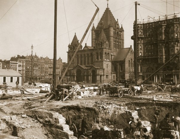 a construction site with a building and a church
