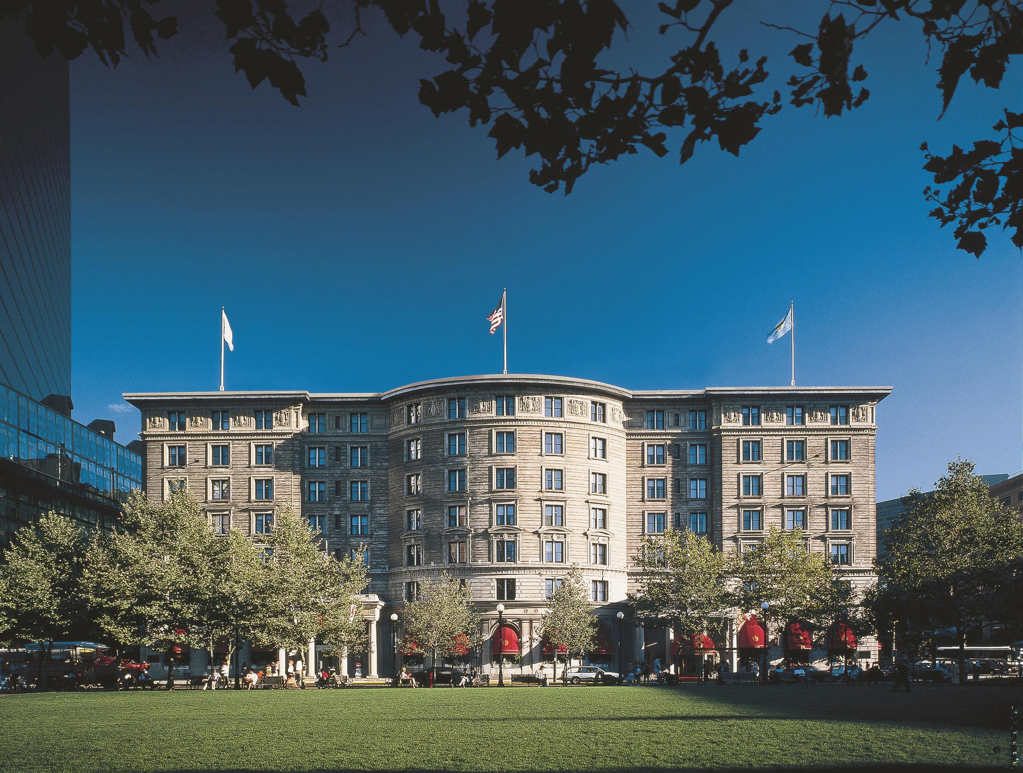 The Fairmont Copley Plaza Hotel with flags on top of it