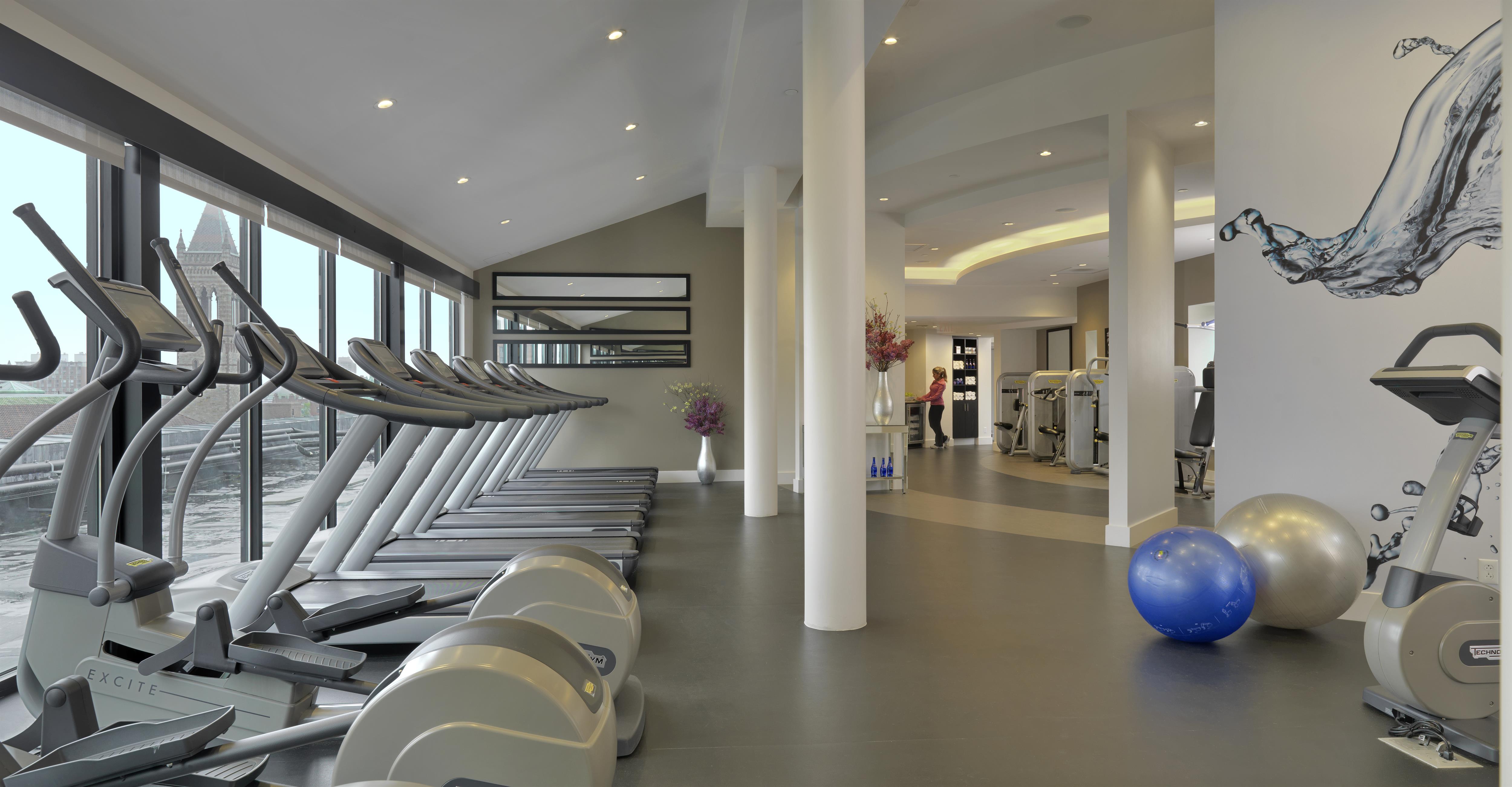 a gym with treadmills and exercise balls