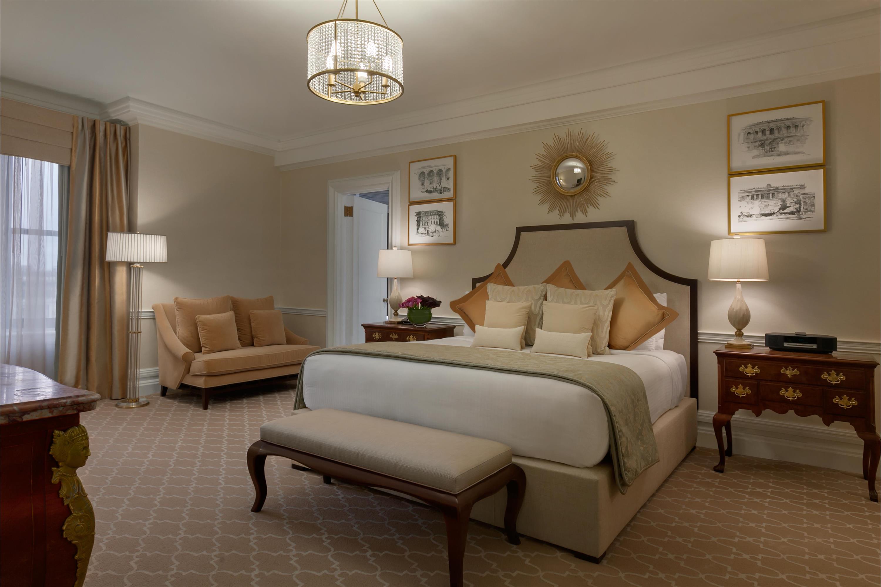a bedroom with a bed and a couch