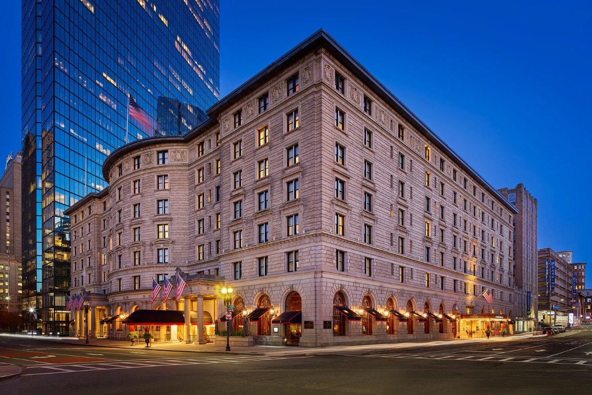 The Fairmont Copley Plaza Hotel with many windows and a tall glass building