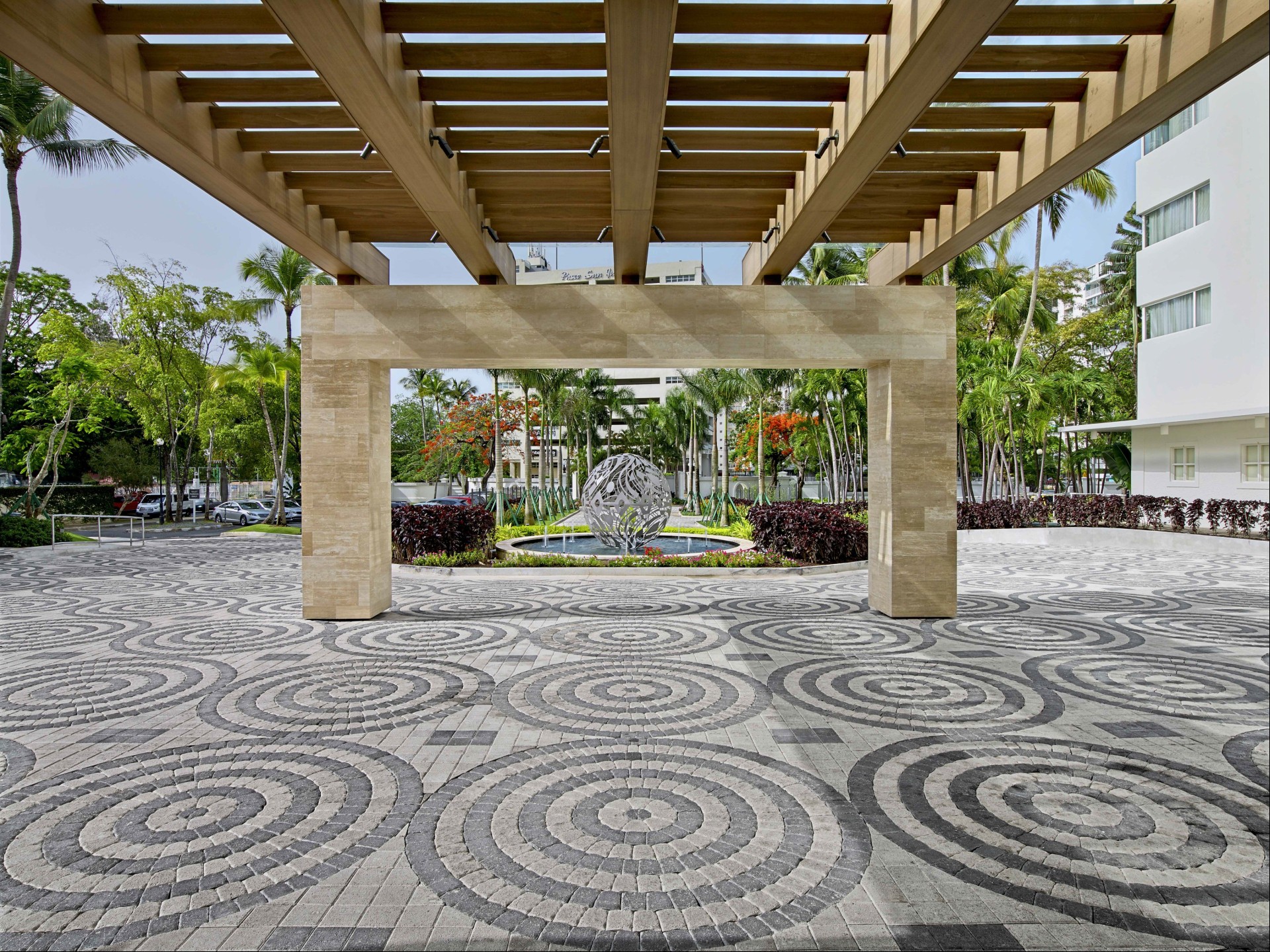 a stone walkway with a large stone structure