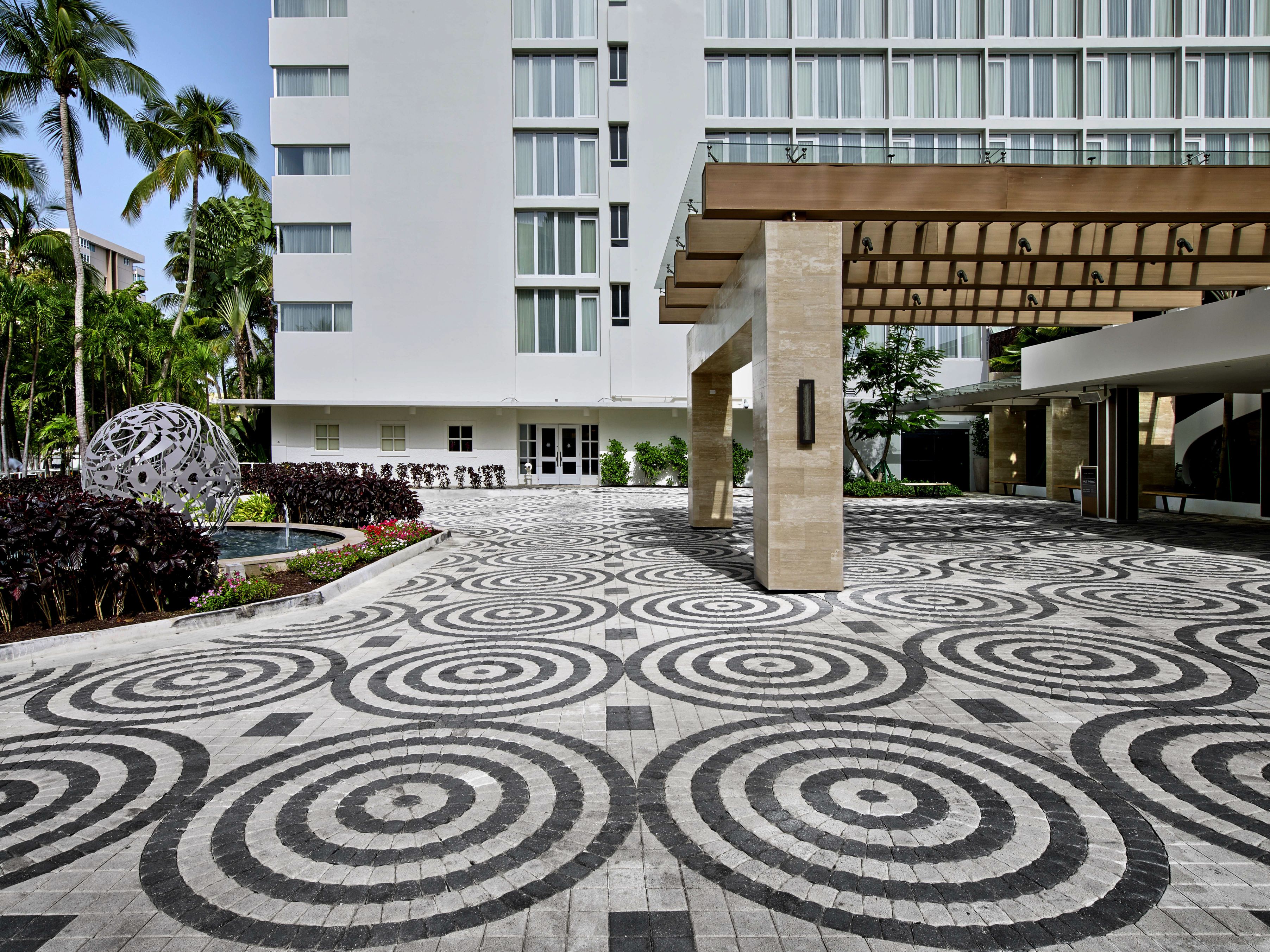 a building with a stone walkway and a stone structure