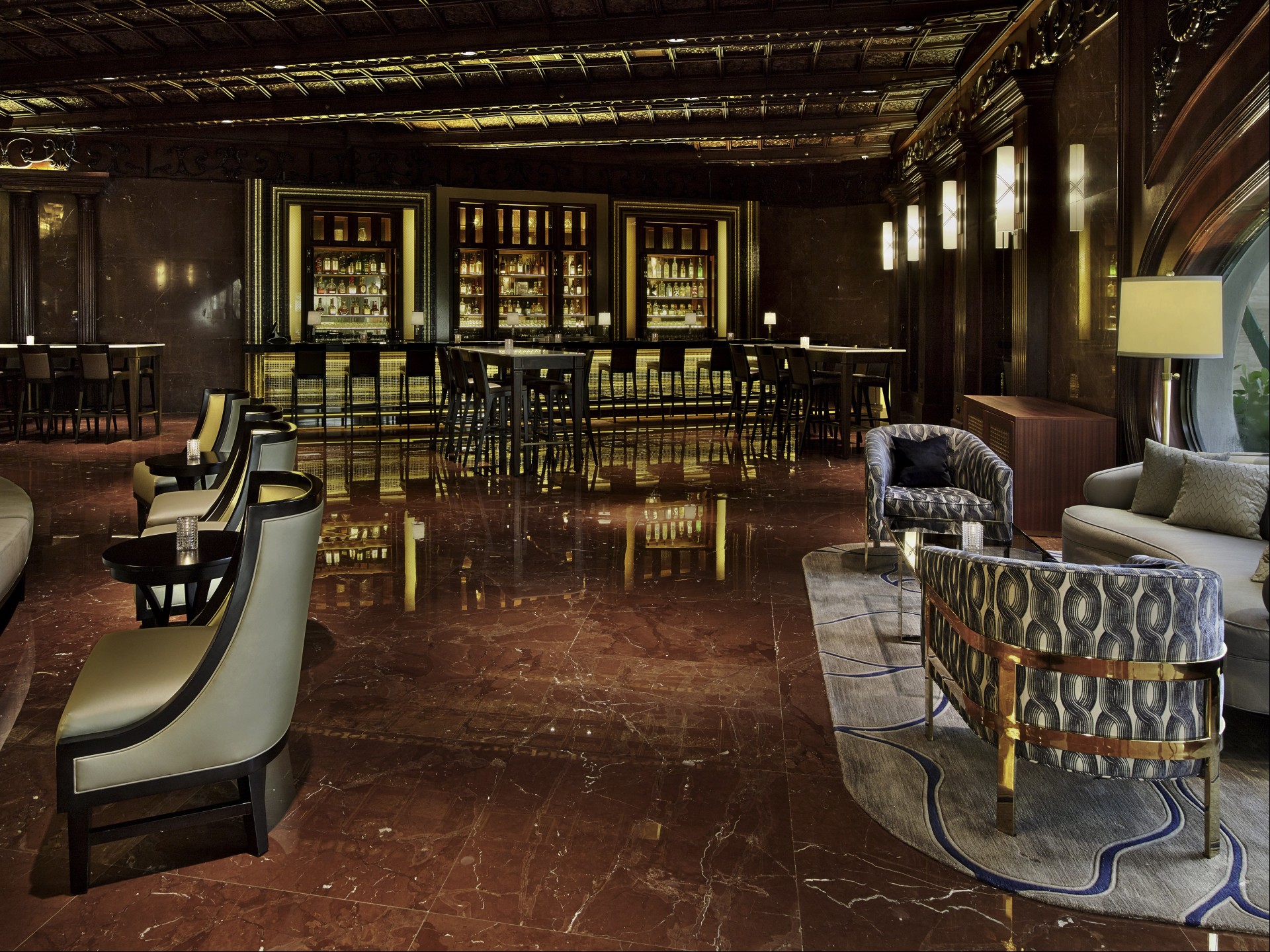 a room with a bar and chairs