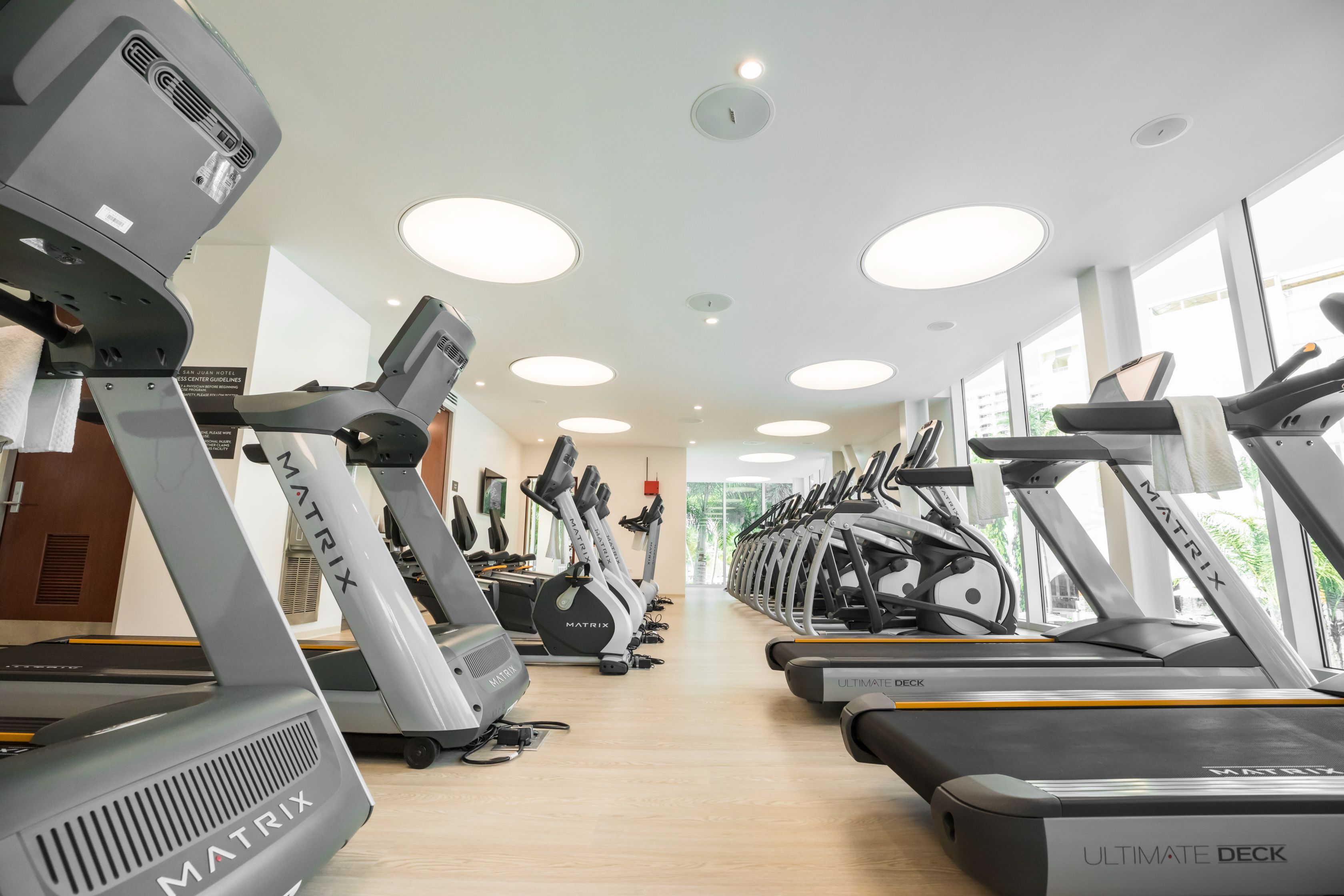 a room with treadmills and exercise machines