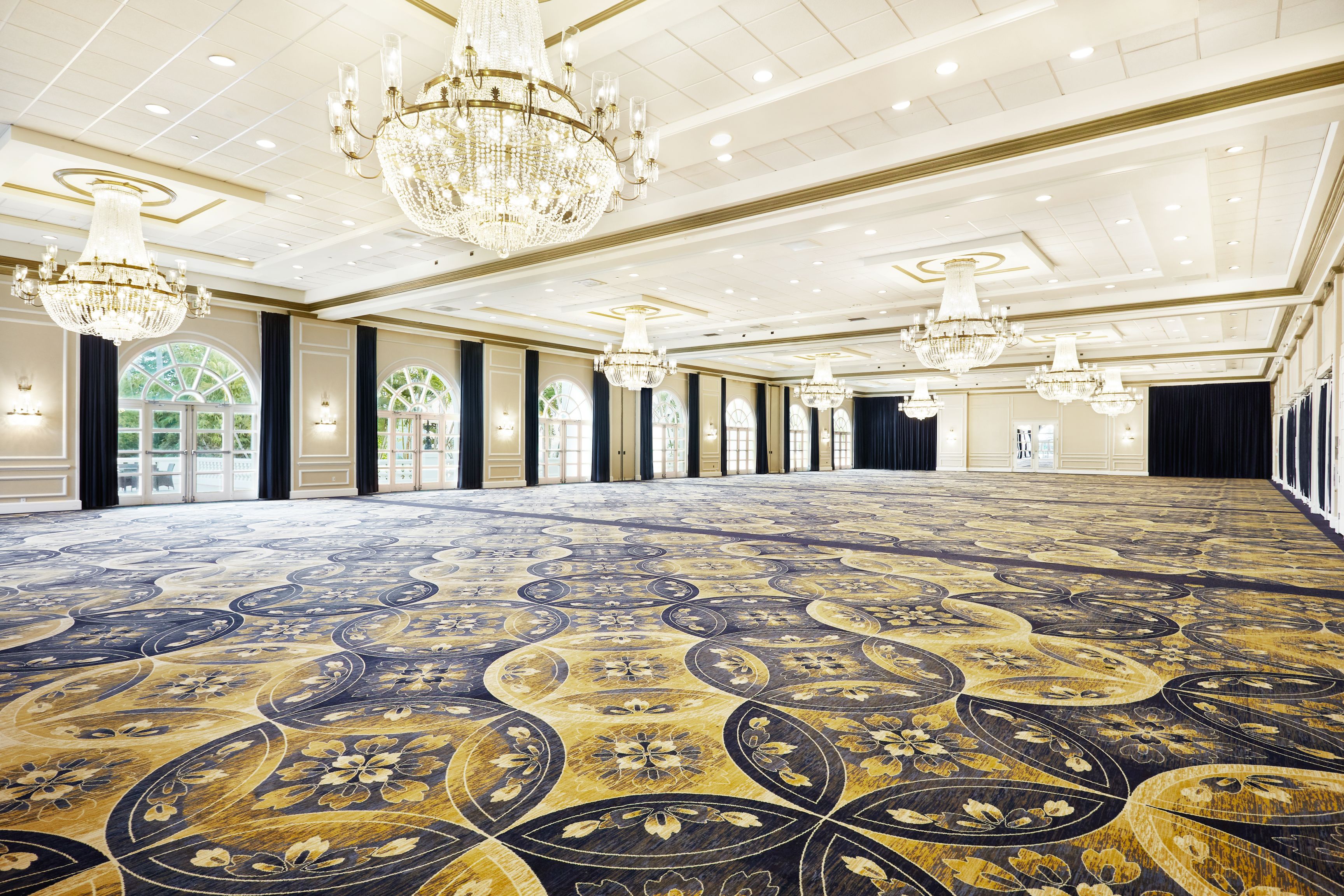 a large room with chandeliers and carpet