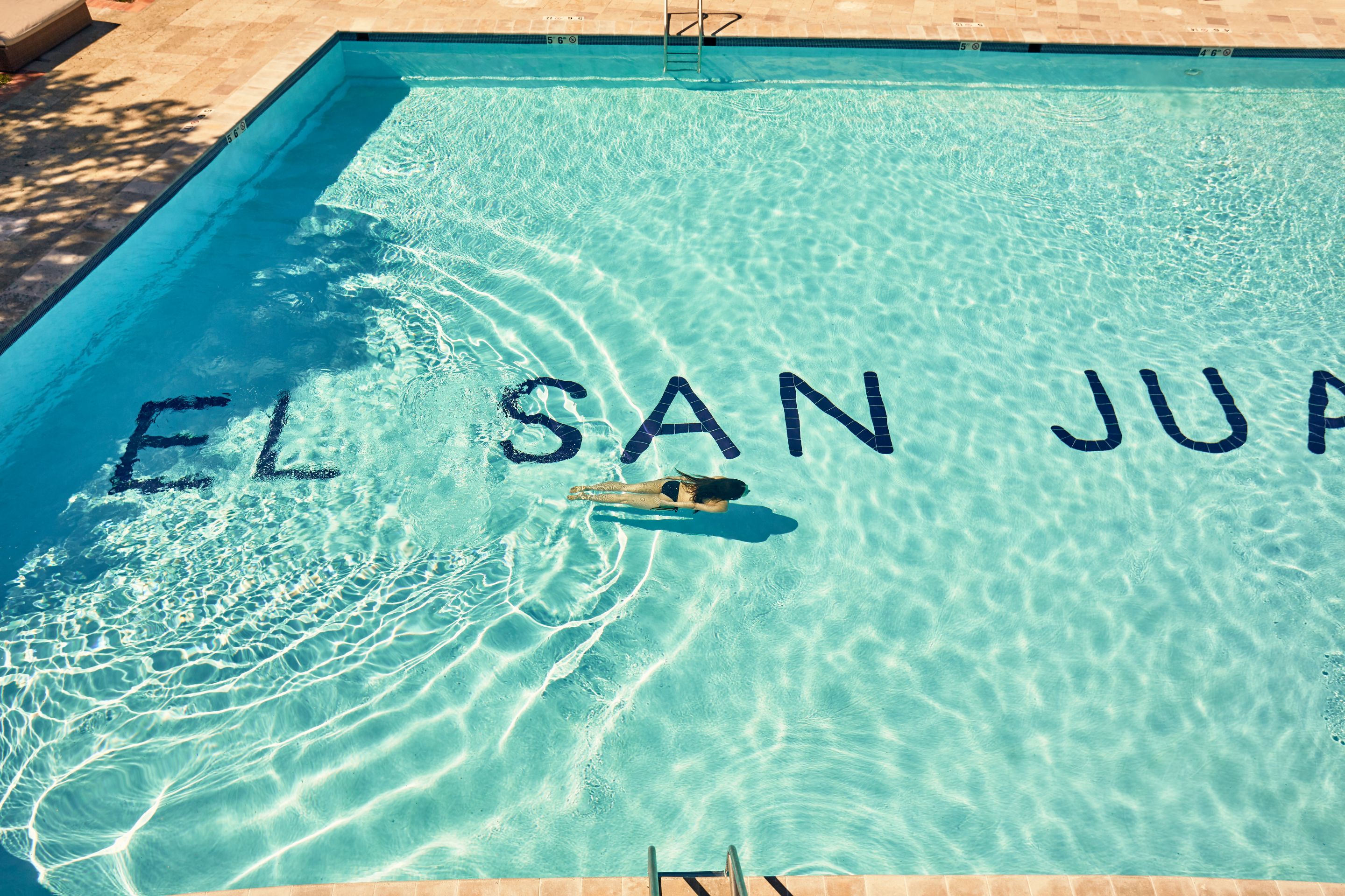 a person swimming in a pool
