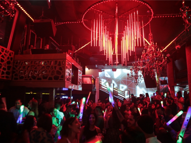 a group of people in a room with lights