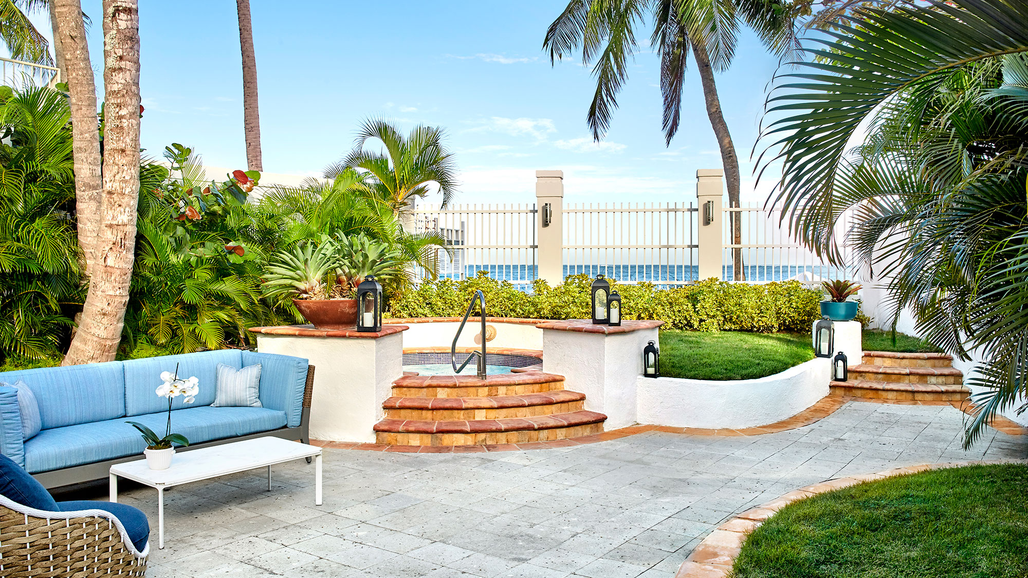 a patio with a pool and a chair