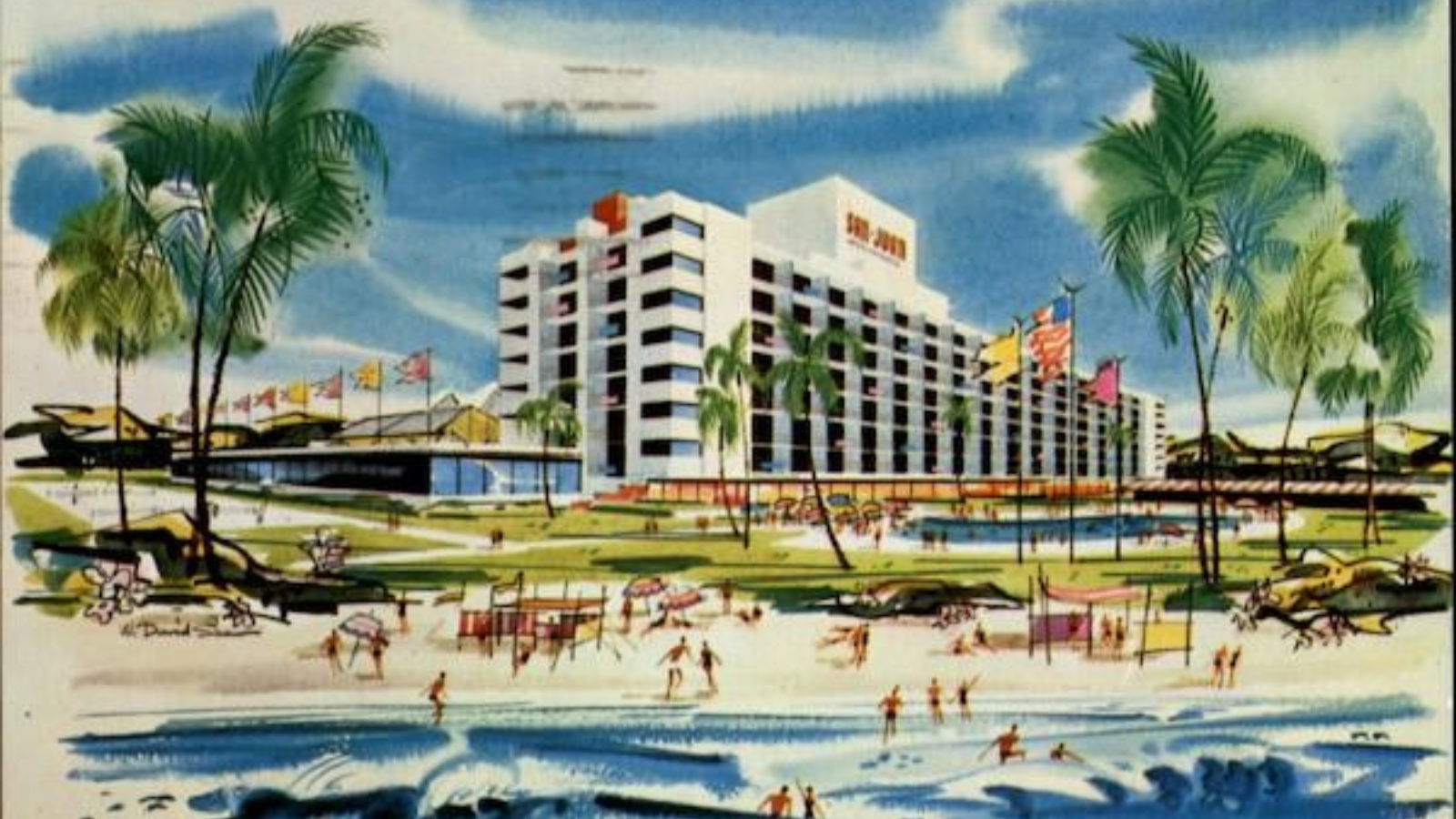 a large building with many people on the beach