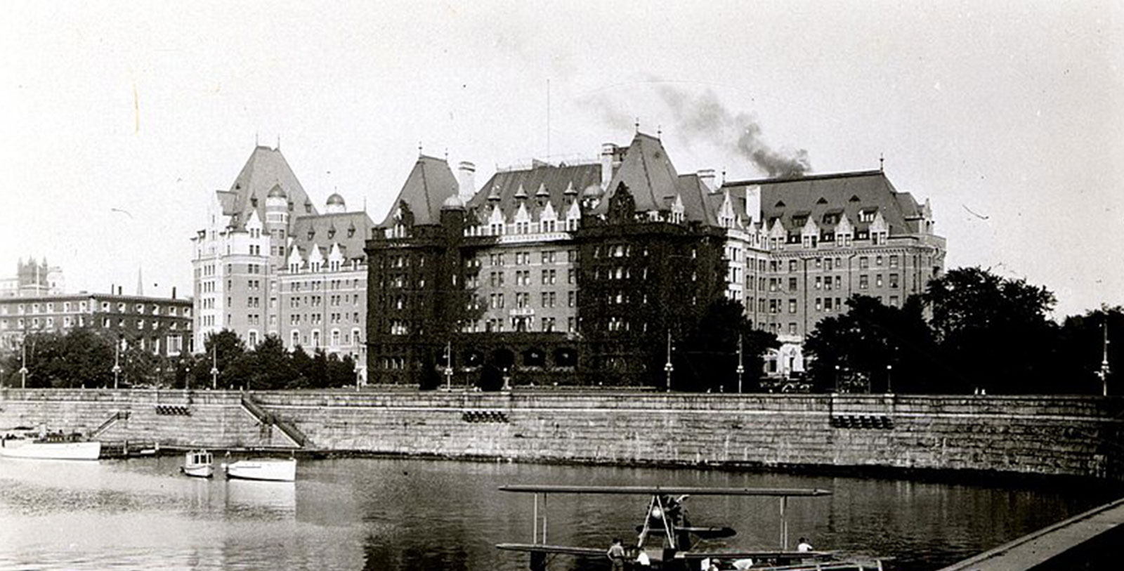 a large building with a boat in the background
