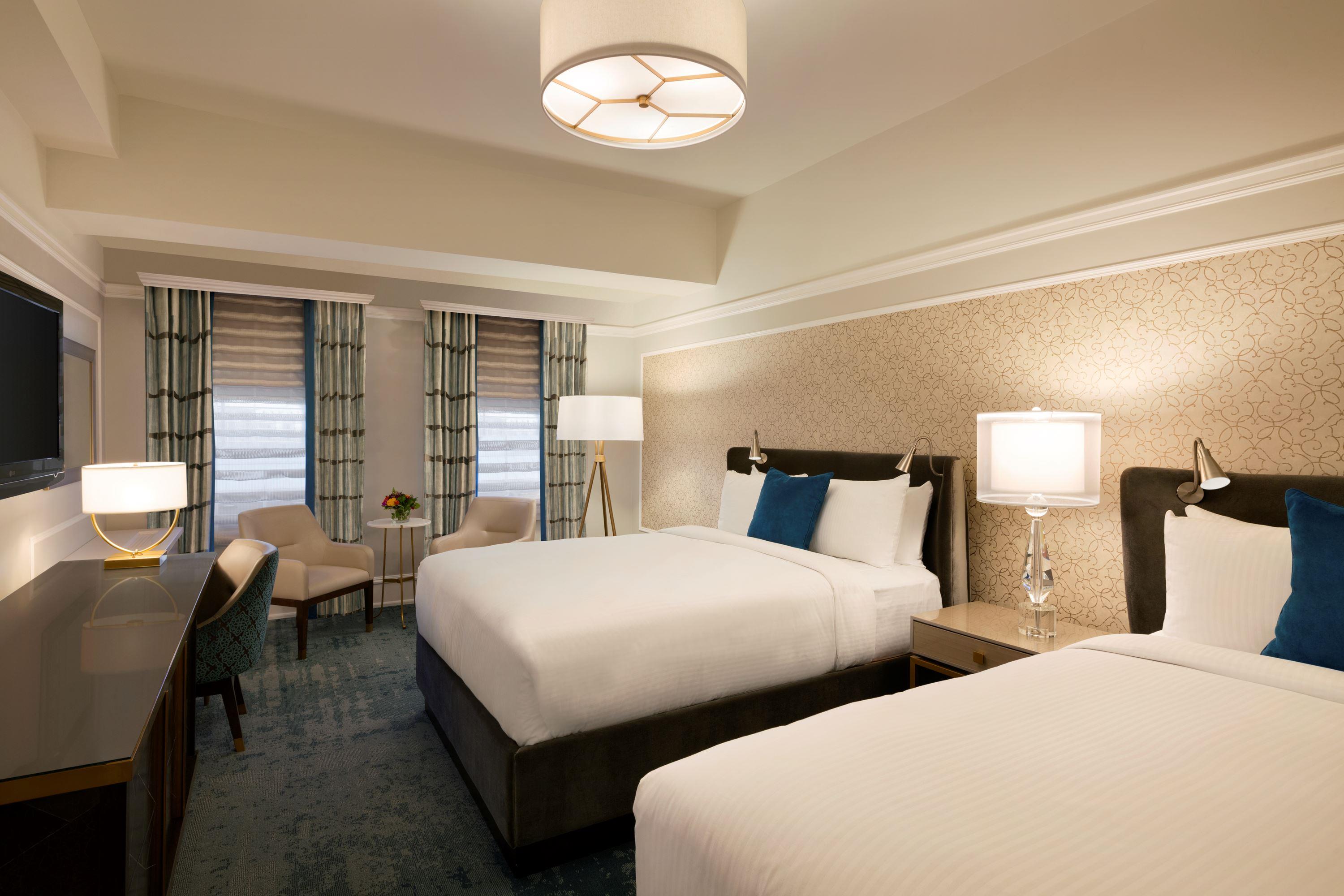 a hotel room with two beds
