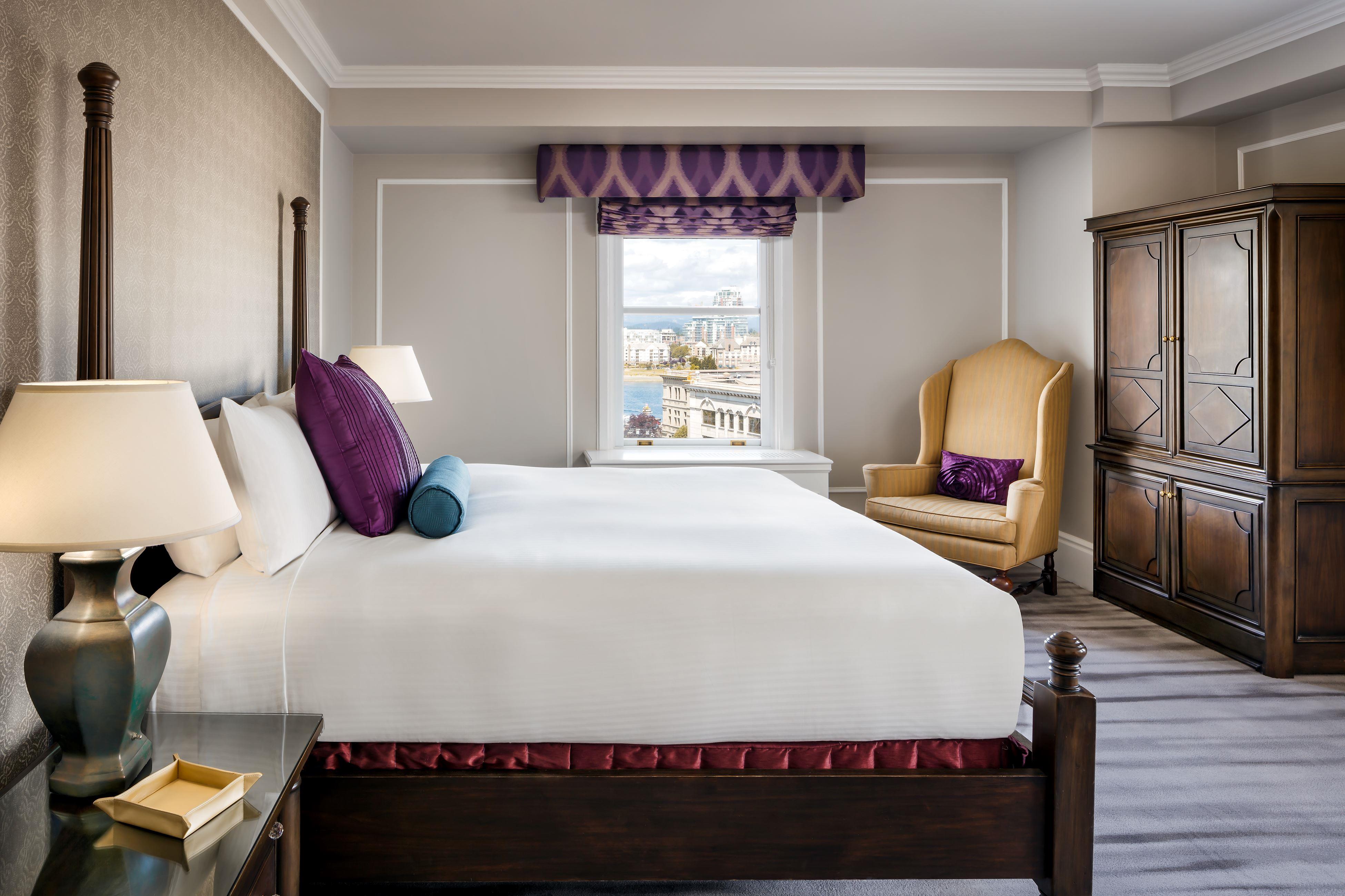 a bedroom with a bed and a chair