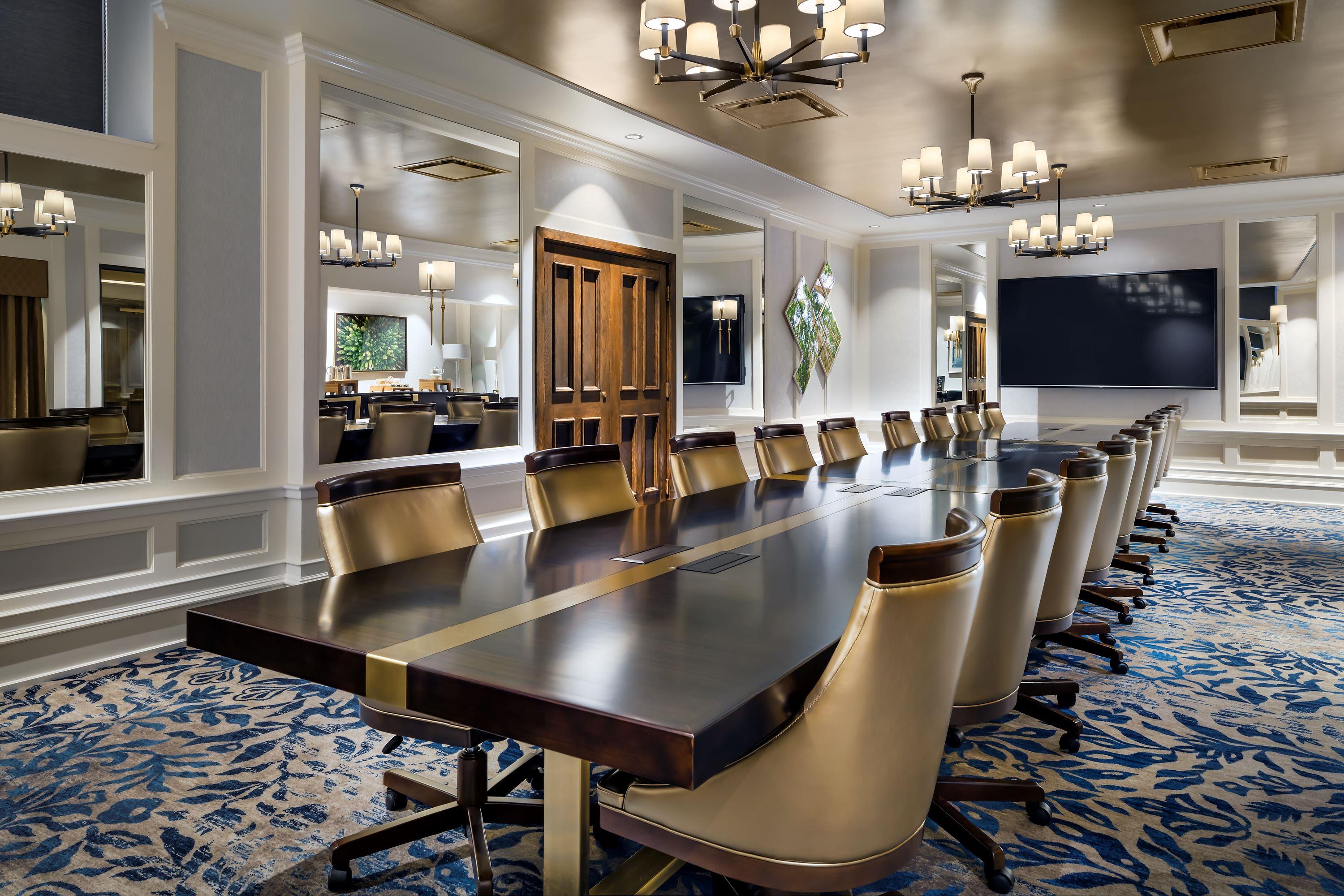 a conference room with a large table and chairs