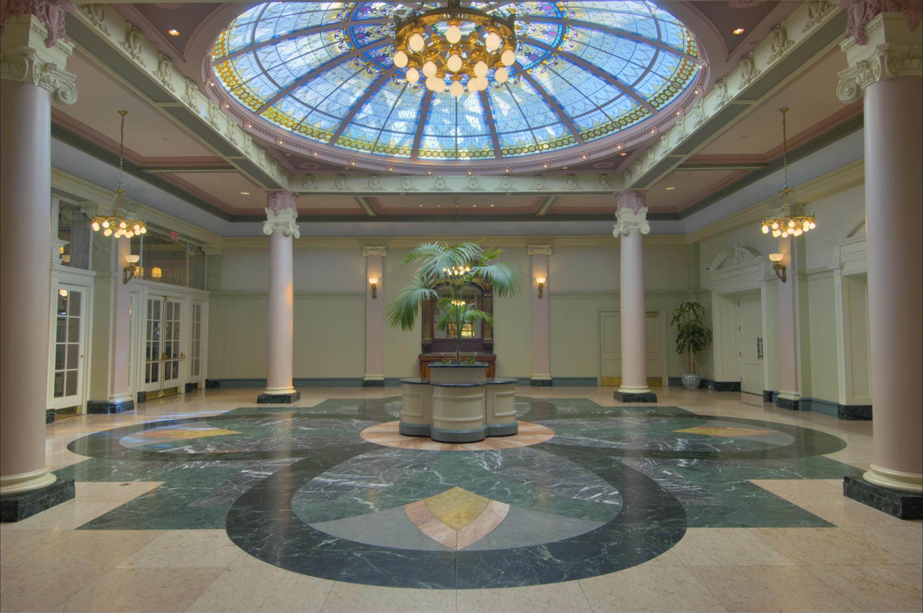 a large room with a stained glass skylight