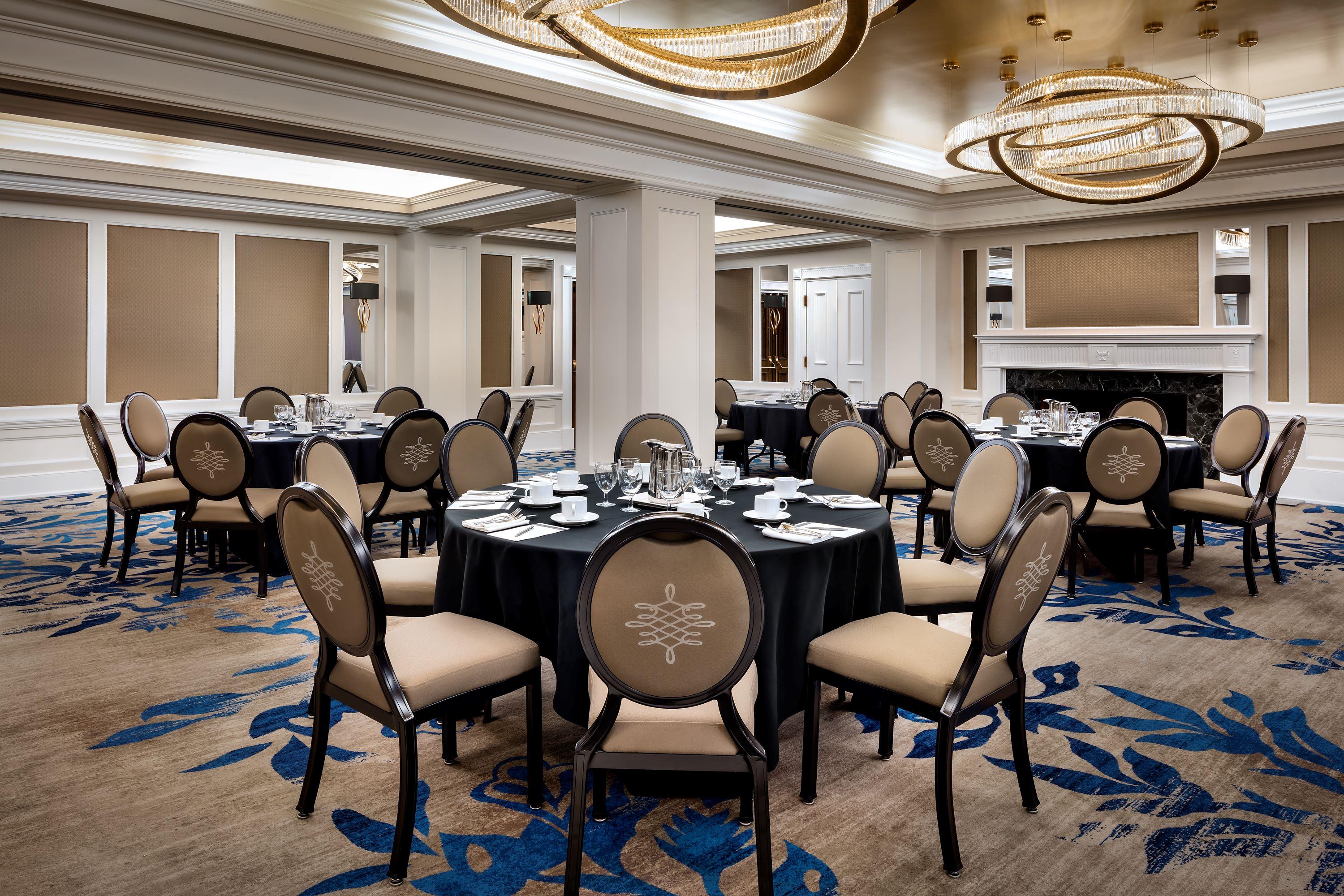 a room with round tables and chairs