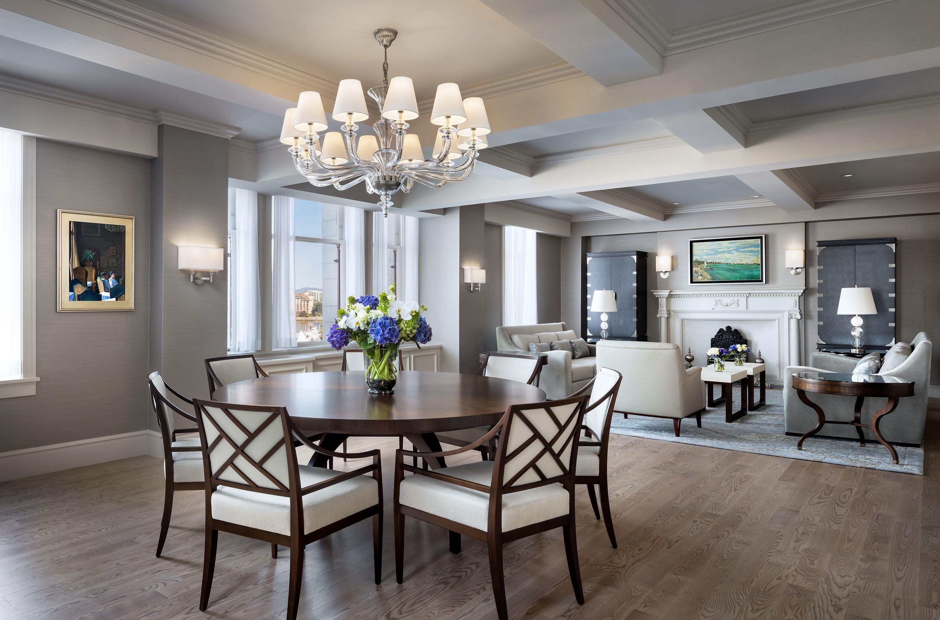 a room with a chandelier and a table