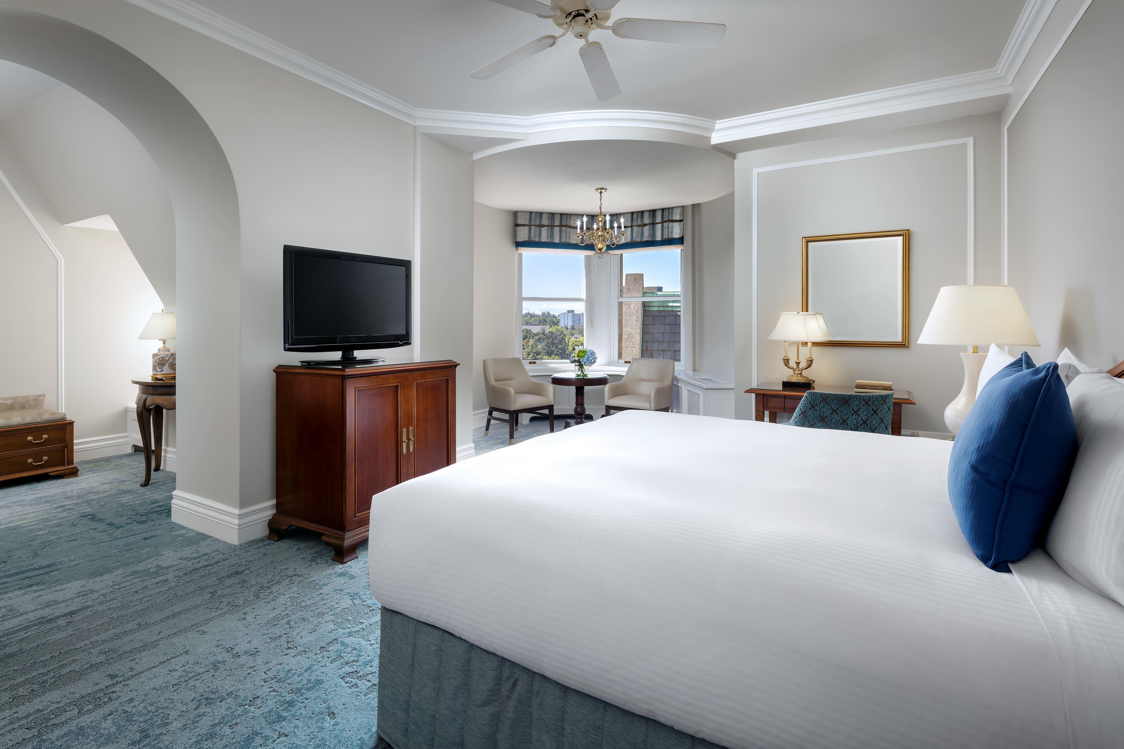 a room with a bed and a television