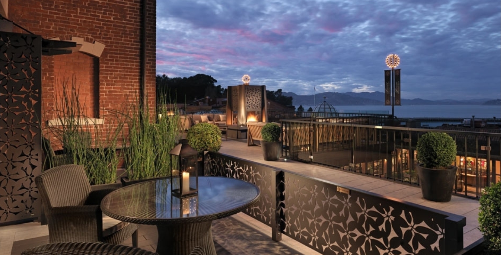 a patio with a table and chairs