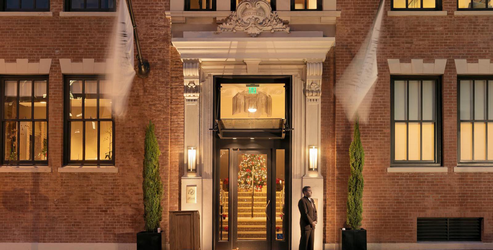 a man standing outside of a building