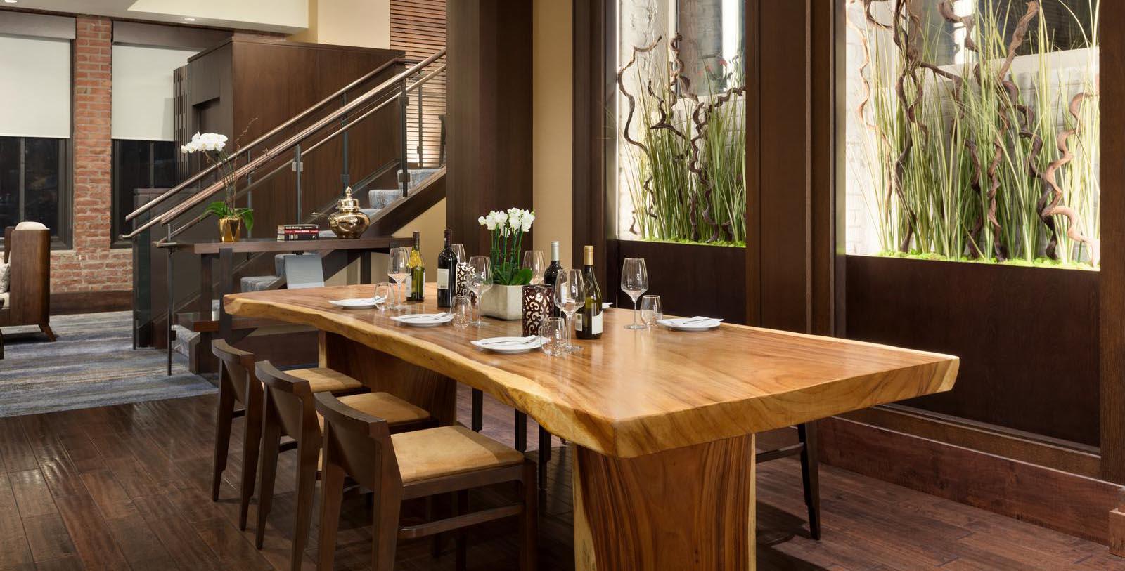 a table with wine bottles and plates on it