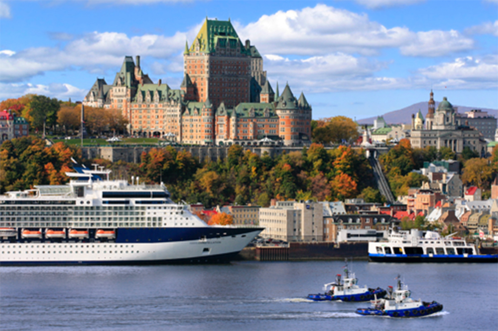 boats in a body of water next to a large building