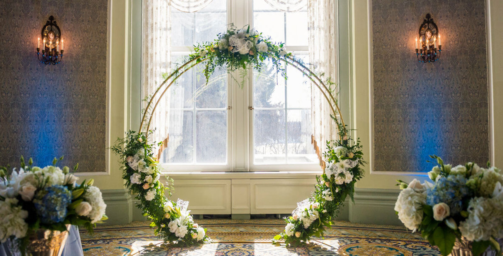 a circular arch with flowers and plants