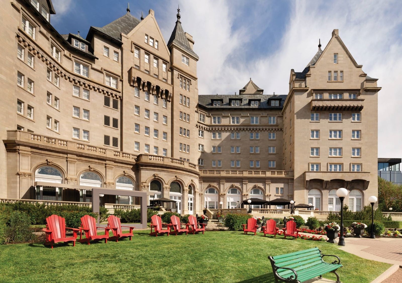 a large building with many chairs in front of it