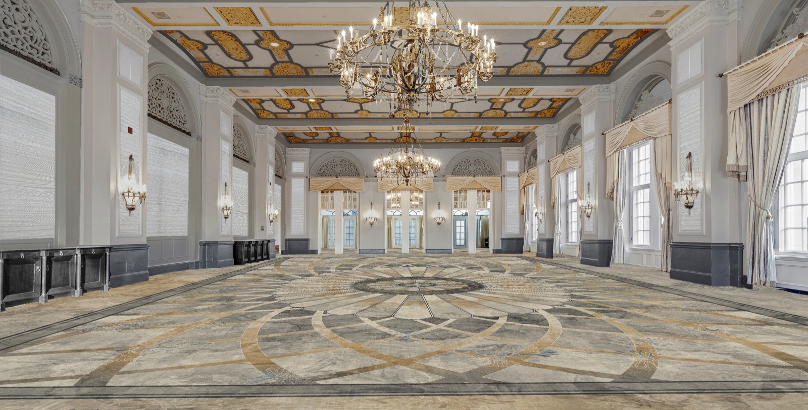 a large room with chandeliers and a large carpet