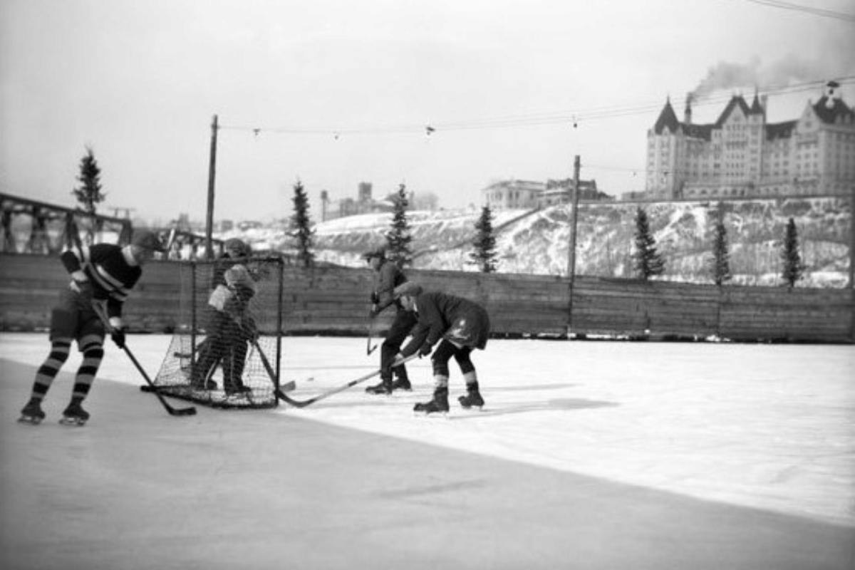 a group of people playing hockey