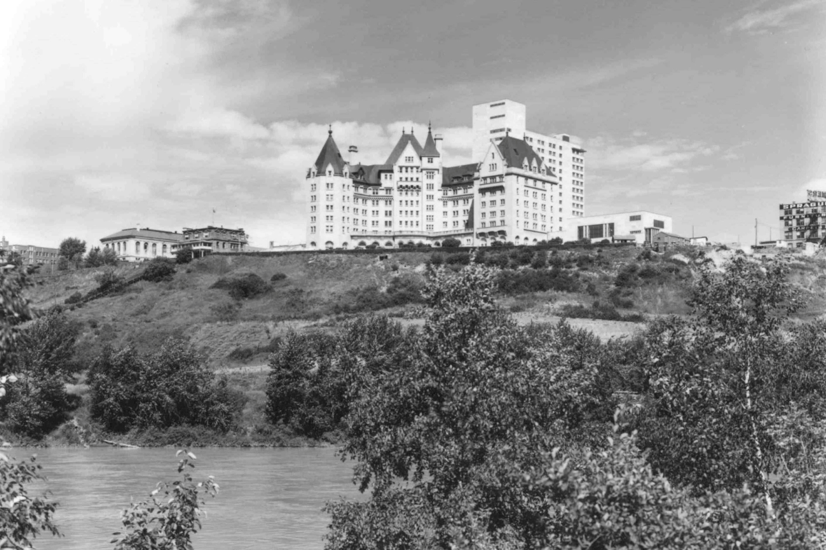 a large white building on a hill