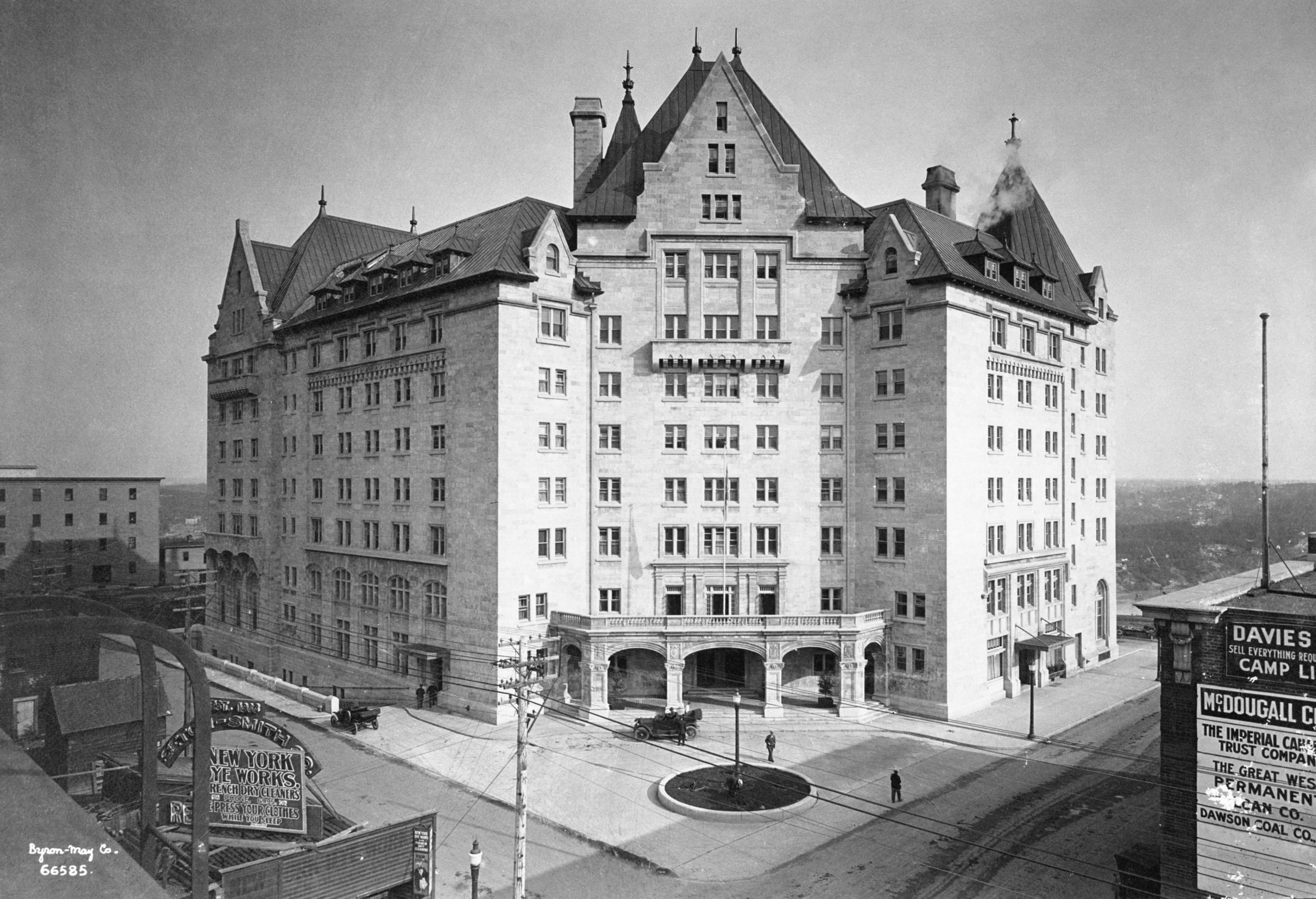 a large building with a street corner with The Dakota in the background