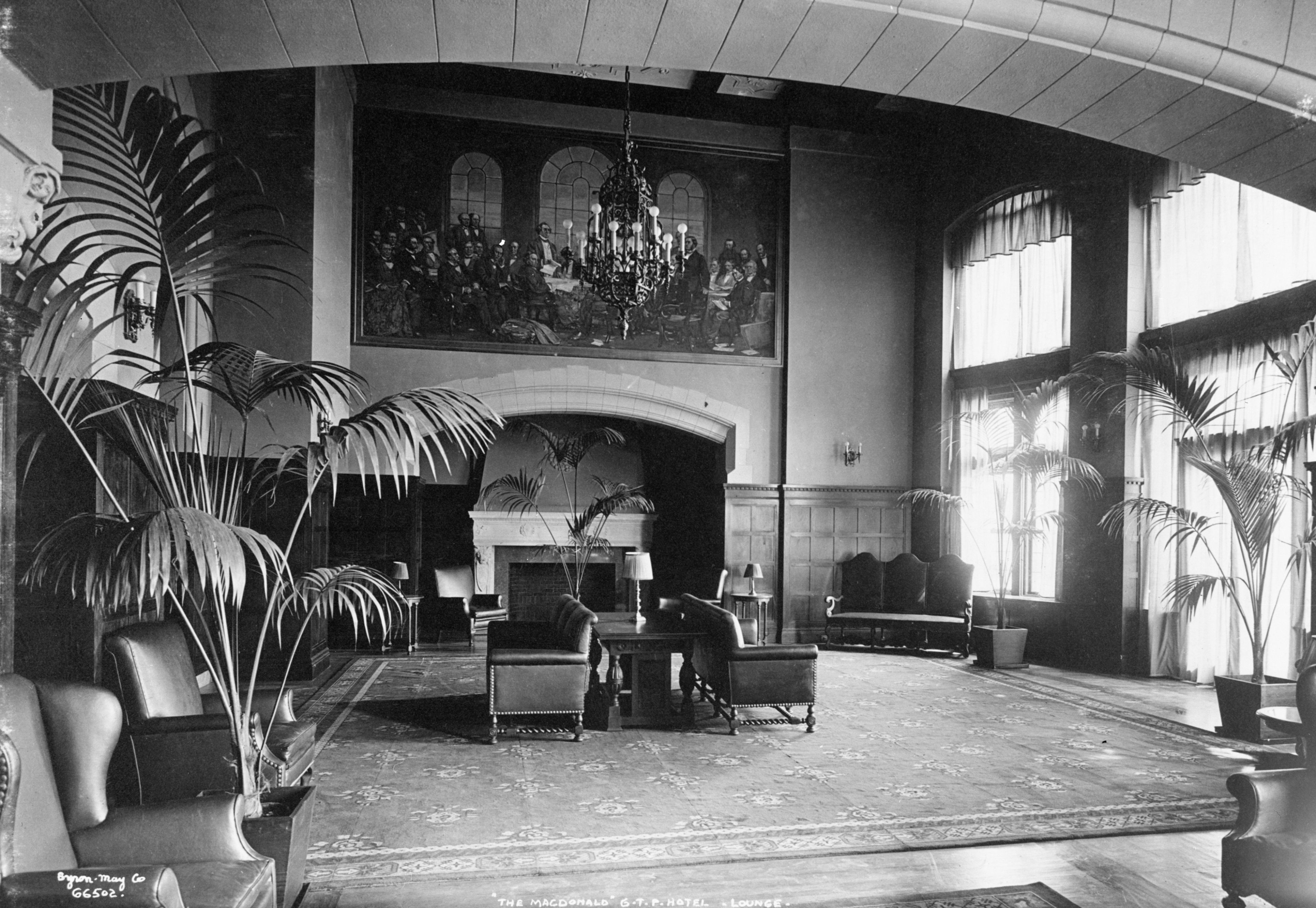 a room with a fireplace and a chandelier