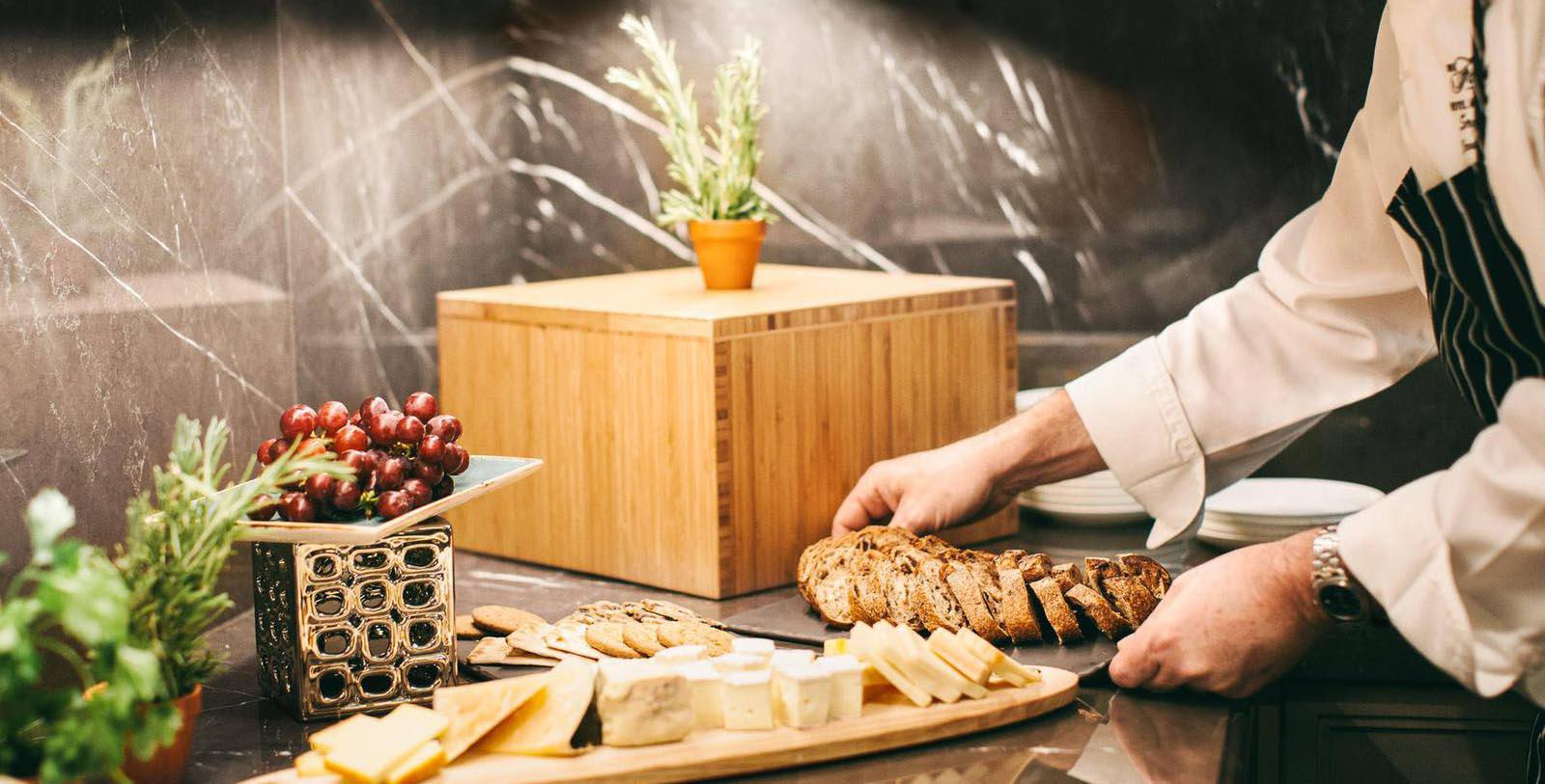 a person cutting bread on a table
