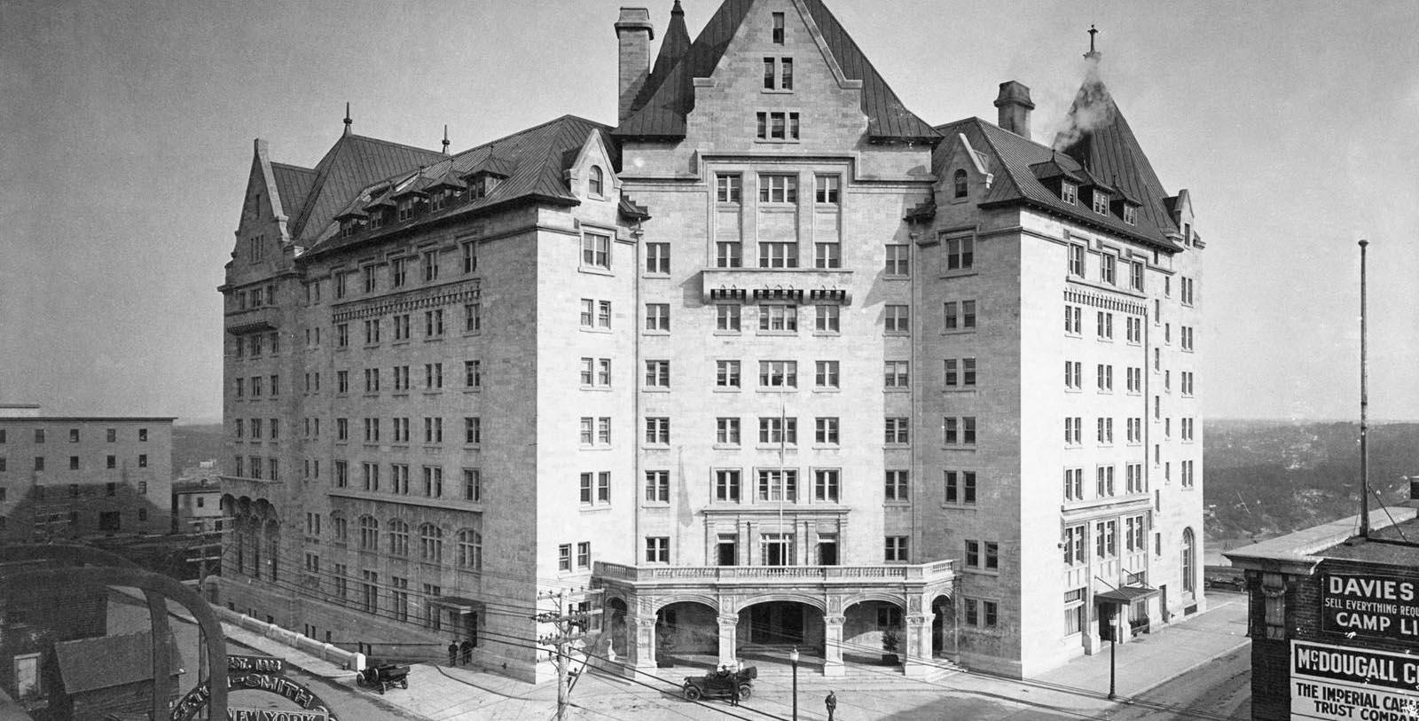 a large building with a street corner with The Dakota in the background