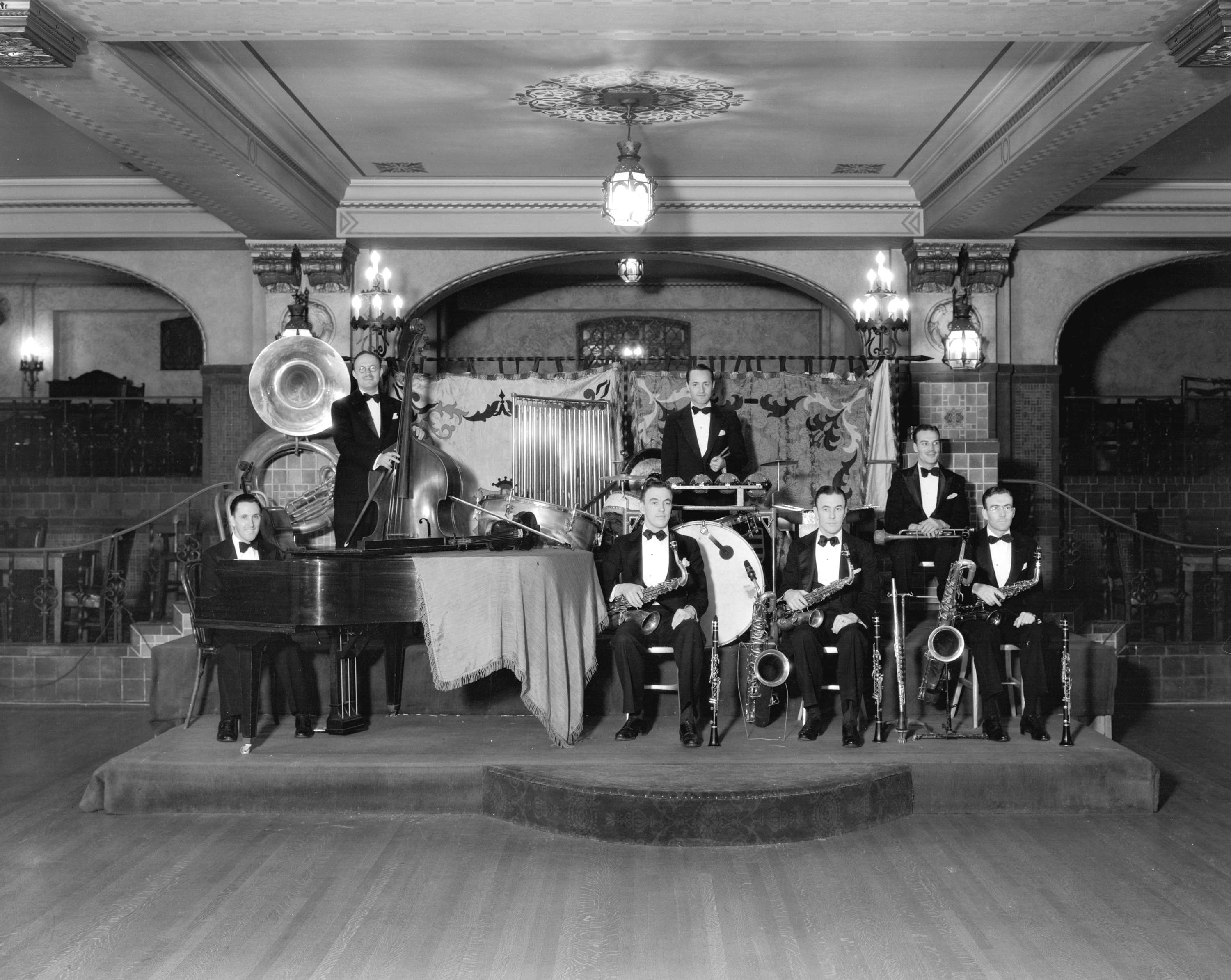 a group of people in suits and instruments