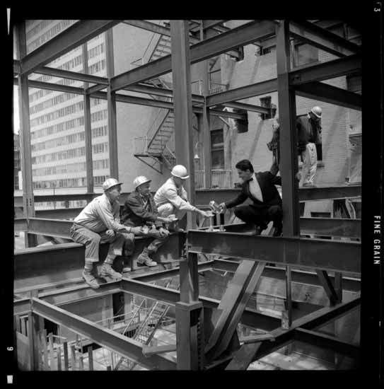 a group of men working on a steel structure