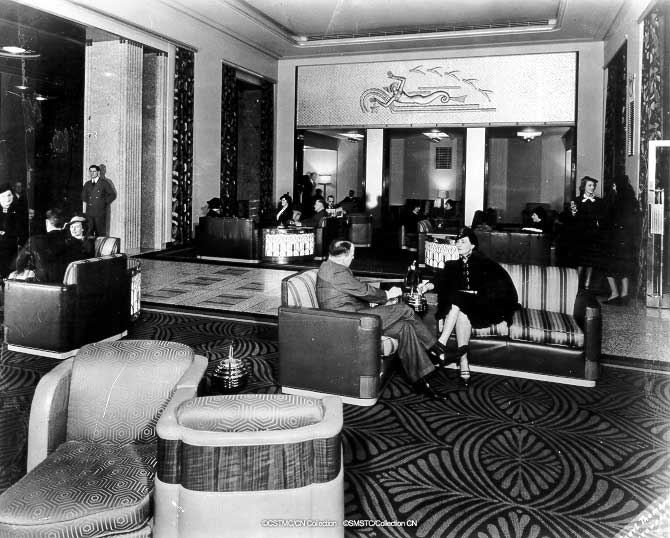 a group of people sitting in a lobby