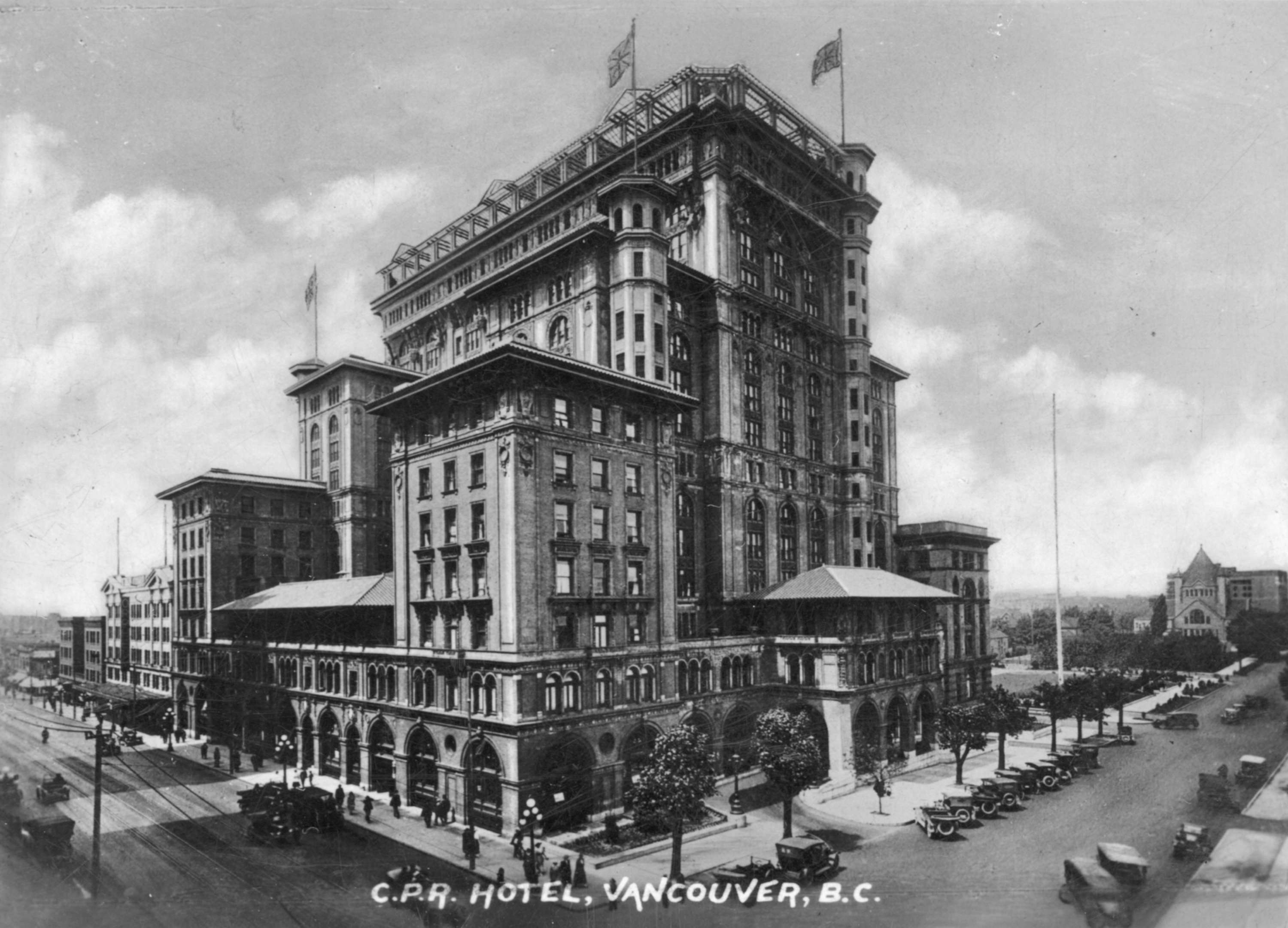 a large building with flags on top