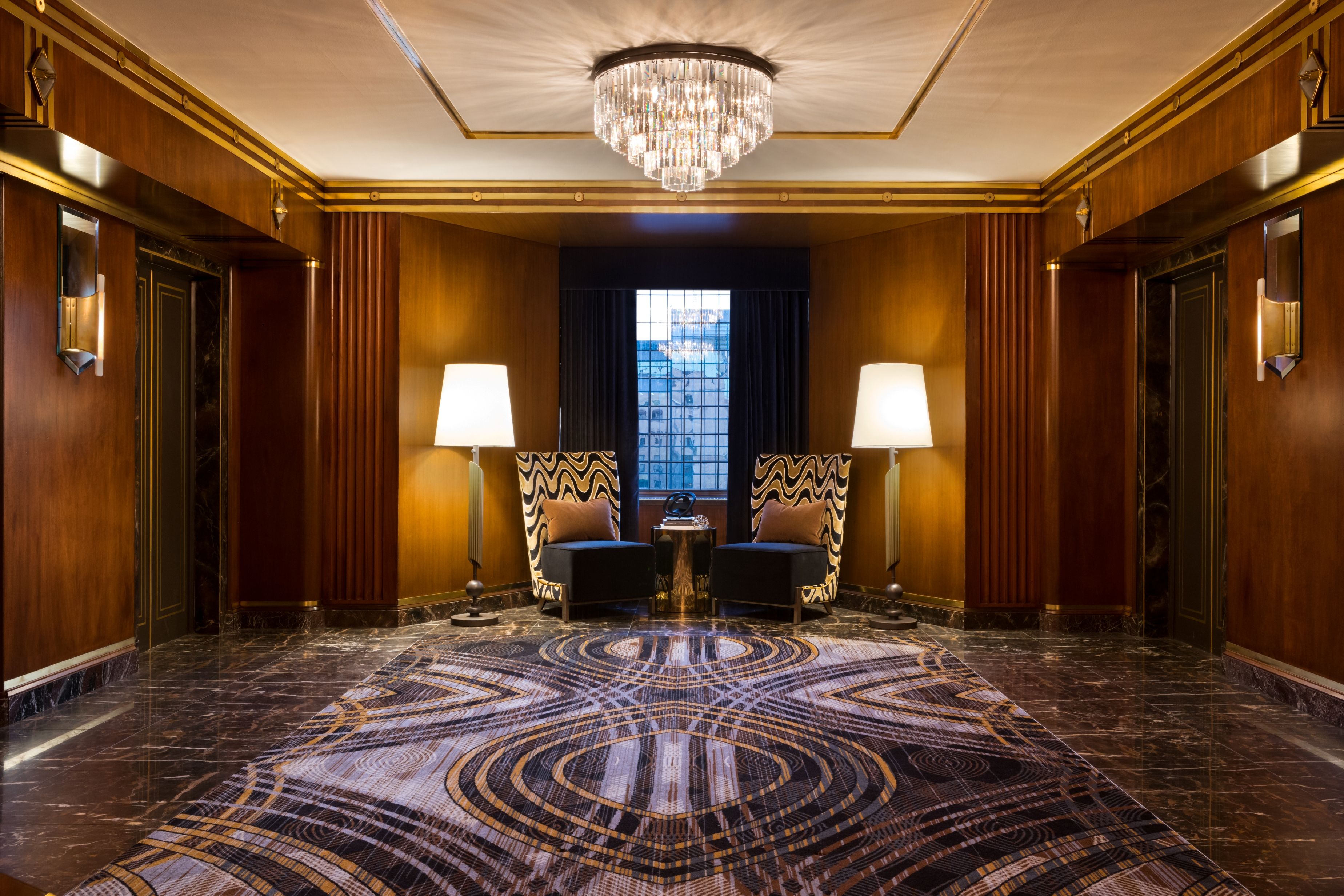 a room with chairs and lamps
