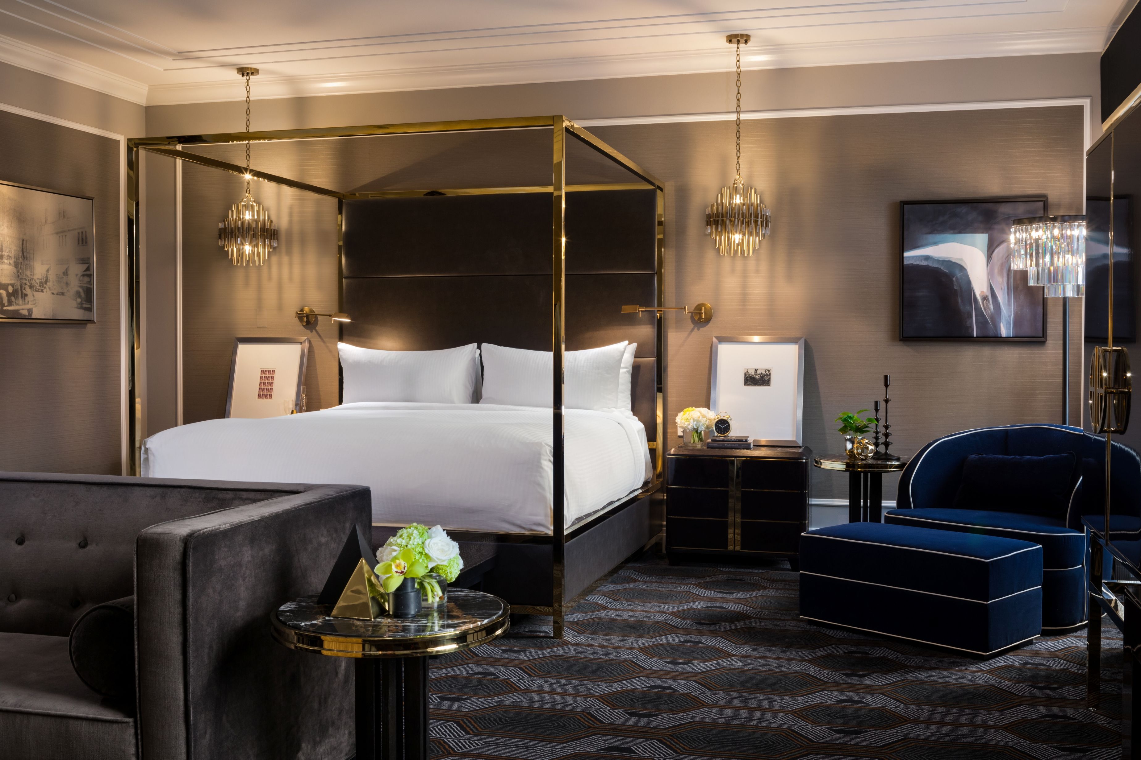 a room with a bed and a blue chair