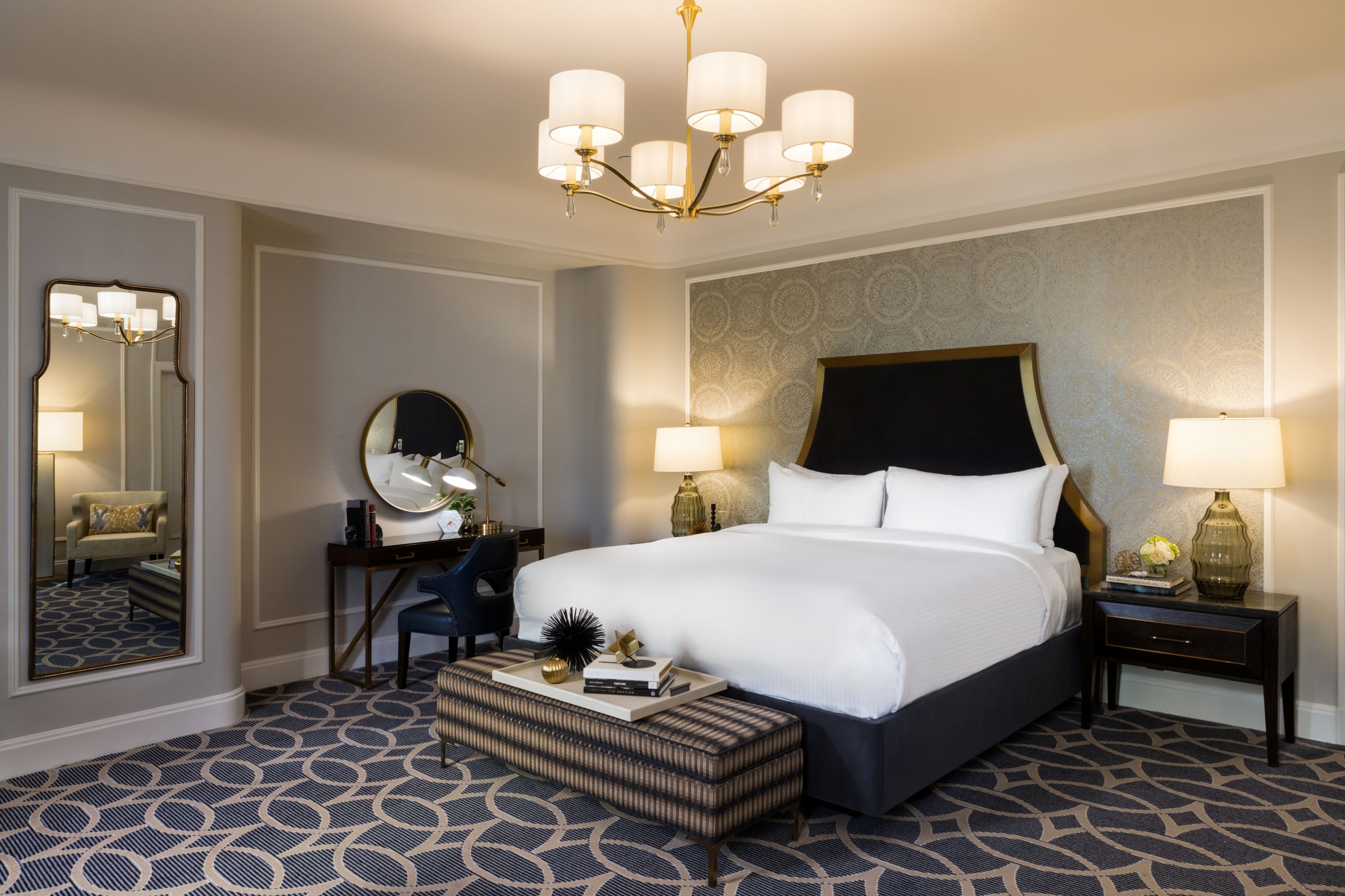 a bedroom with a bed and a mirror