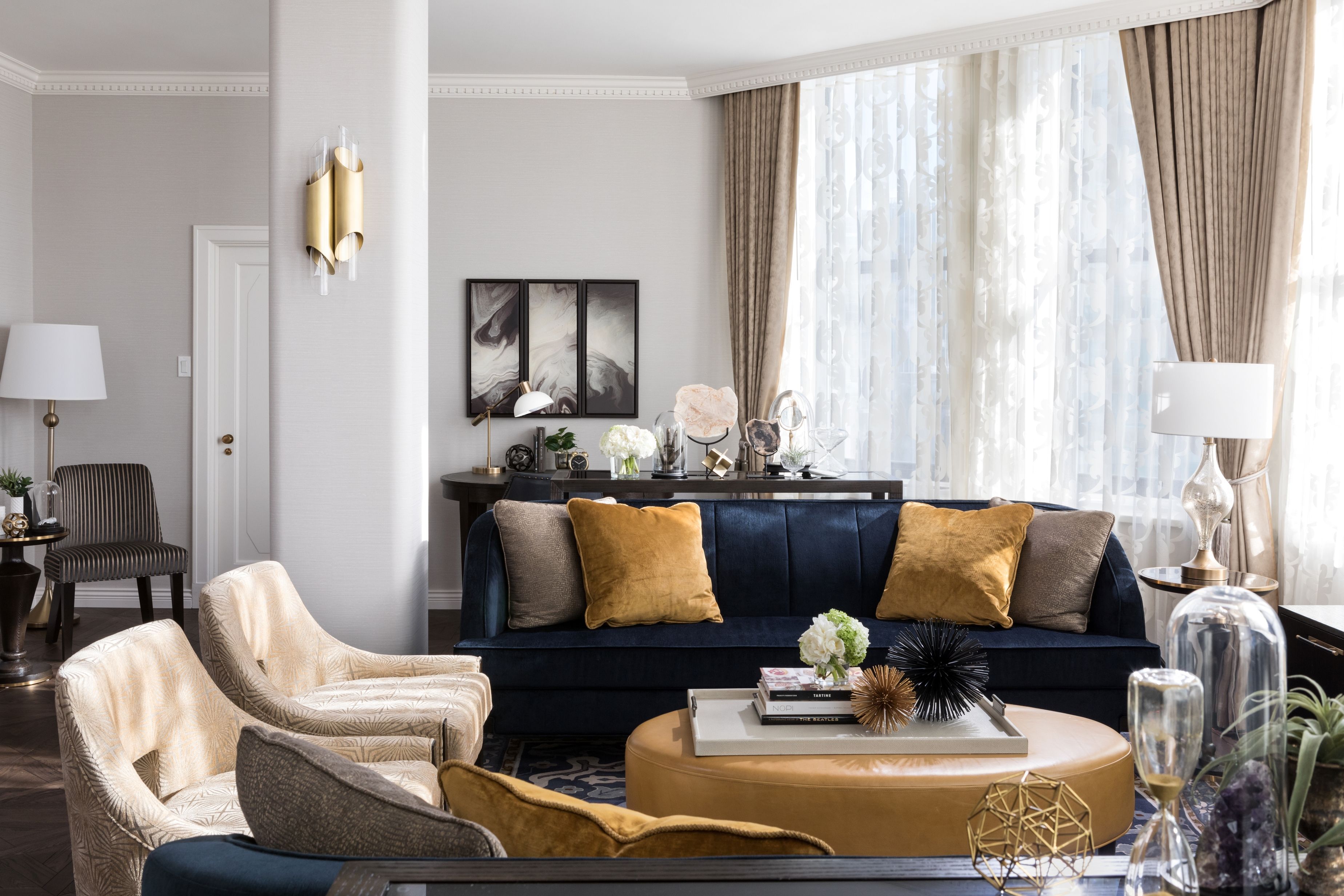 a living room with a couch and chairs