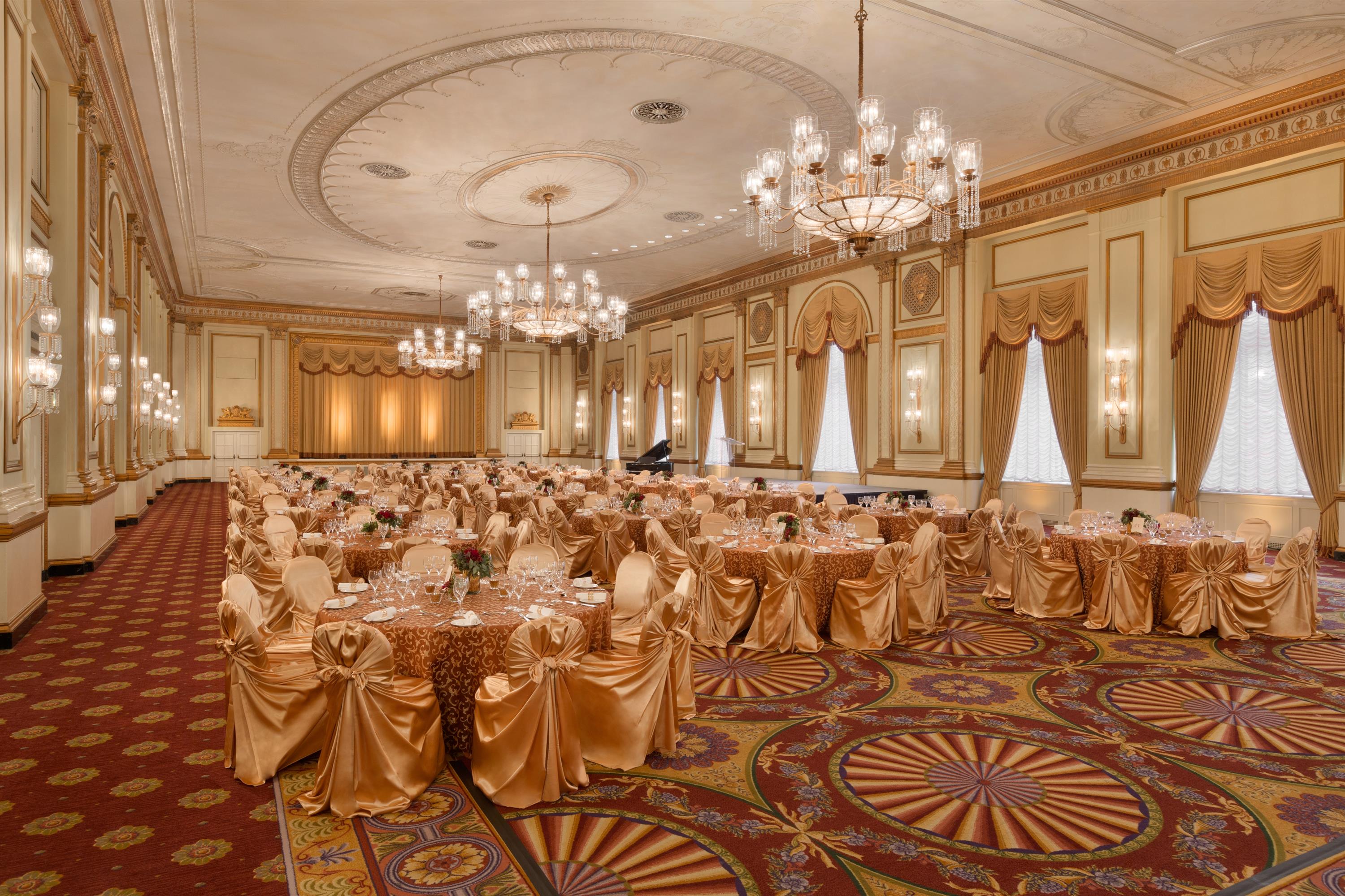 a large ballroom with tables and chairs