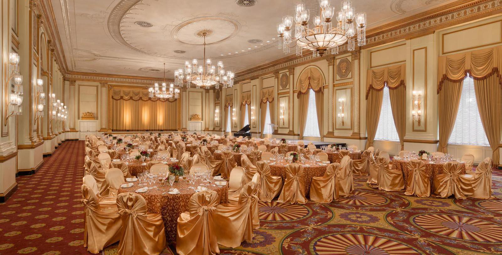 a large ballroom with tables and chairs