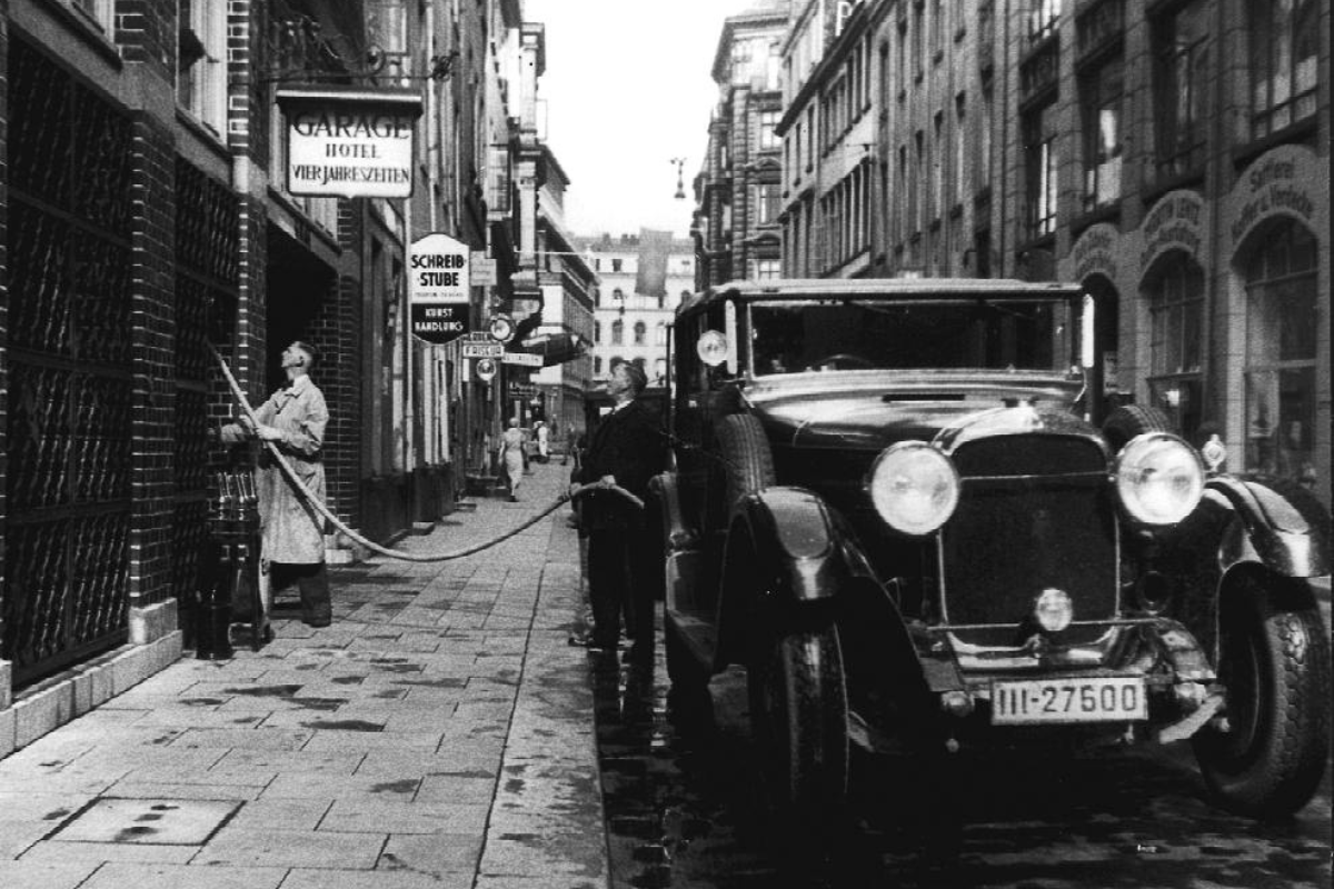 a man standing next to a car