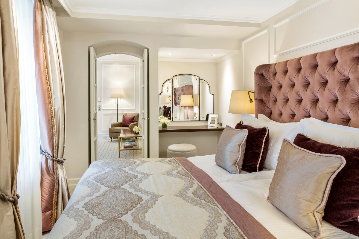 a bedroom with a bed and a mirror