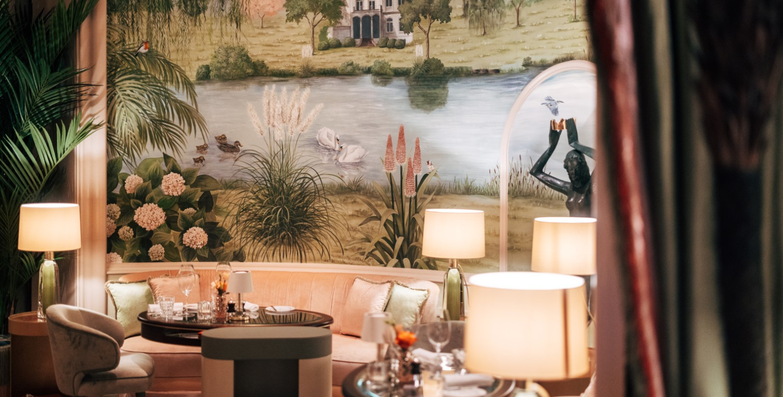 a room with a wall mural and a couch