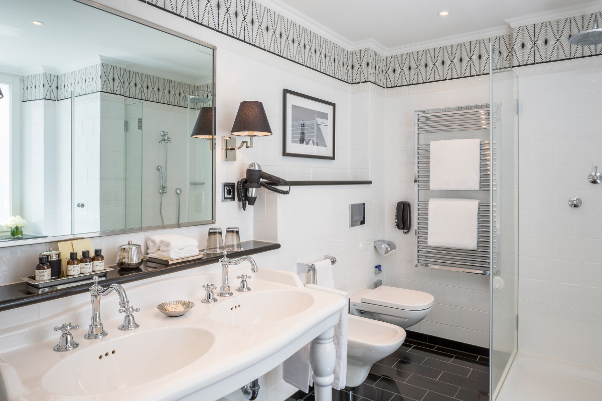 a bathroom with a sink toilet and mirror