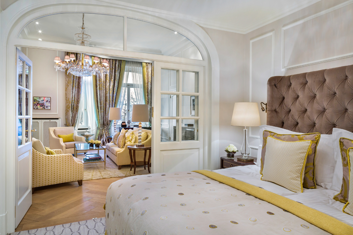 a bedroom with a large bed and a large couch